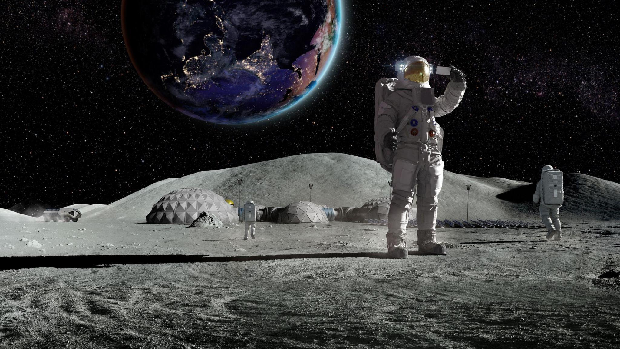 an artists drawing of an astronaut on the moon with moonbases taking a selfie with Earth in the background