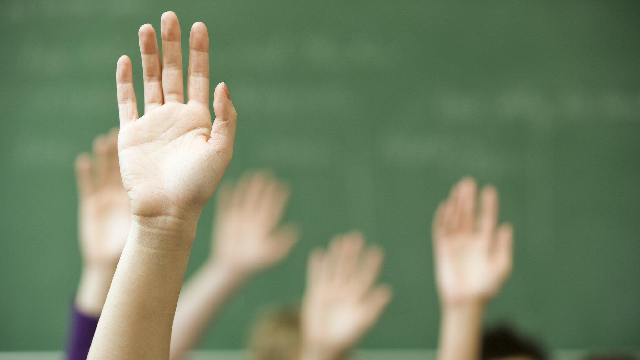 Hands up in classroom