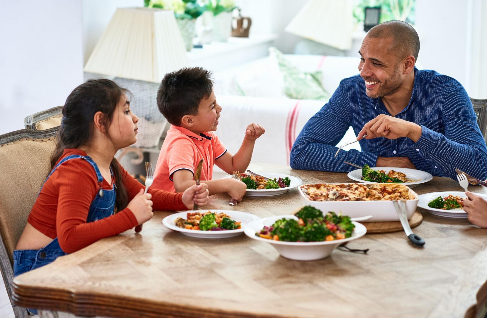 Family talking at meal time.