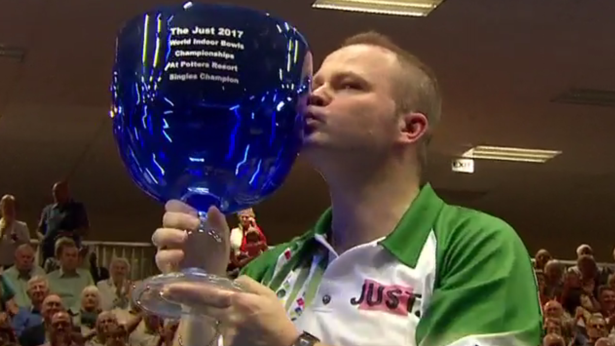 Paul Foster kisses his trophy