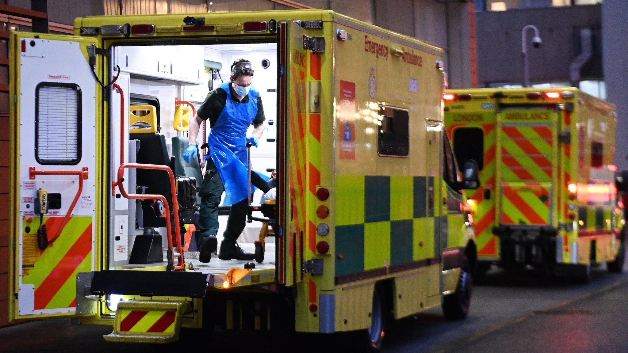 NHS Ambulance staff outside the Royal London hospital in London