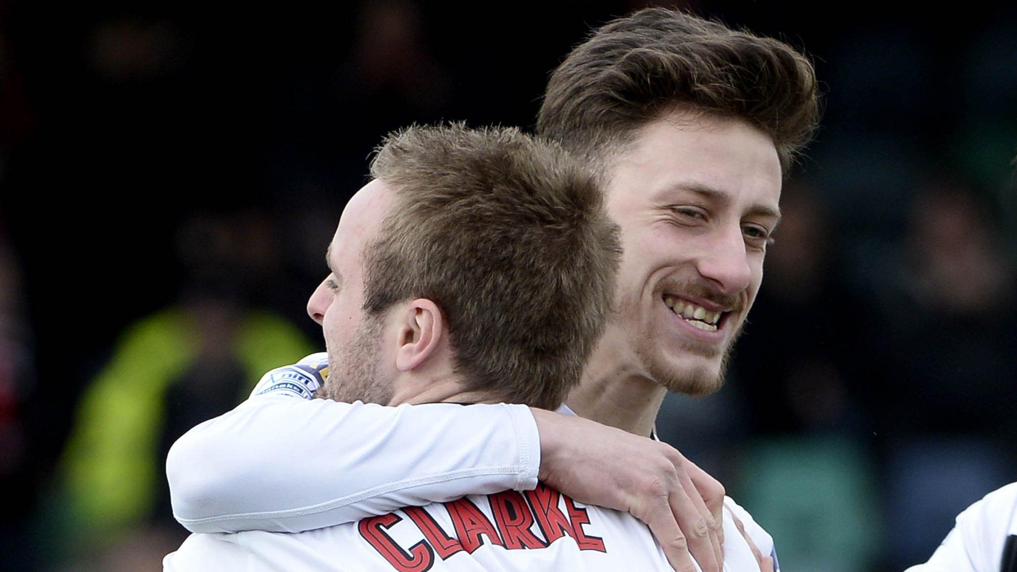 Jordan Forsythe celebrates with Richard Clarke after putting Crusaders ahead against Carrick Rangers