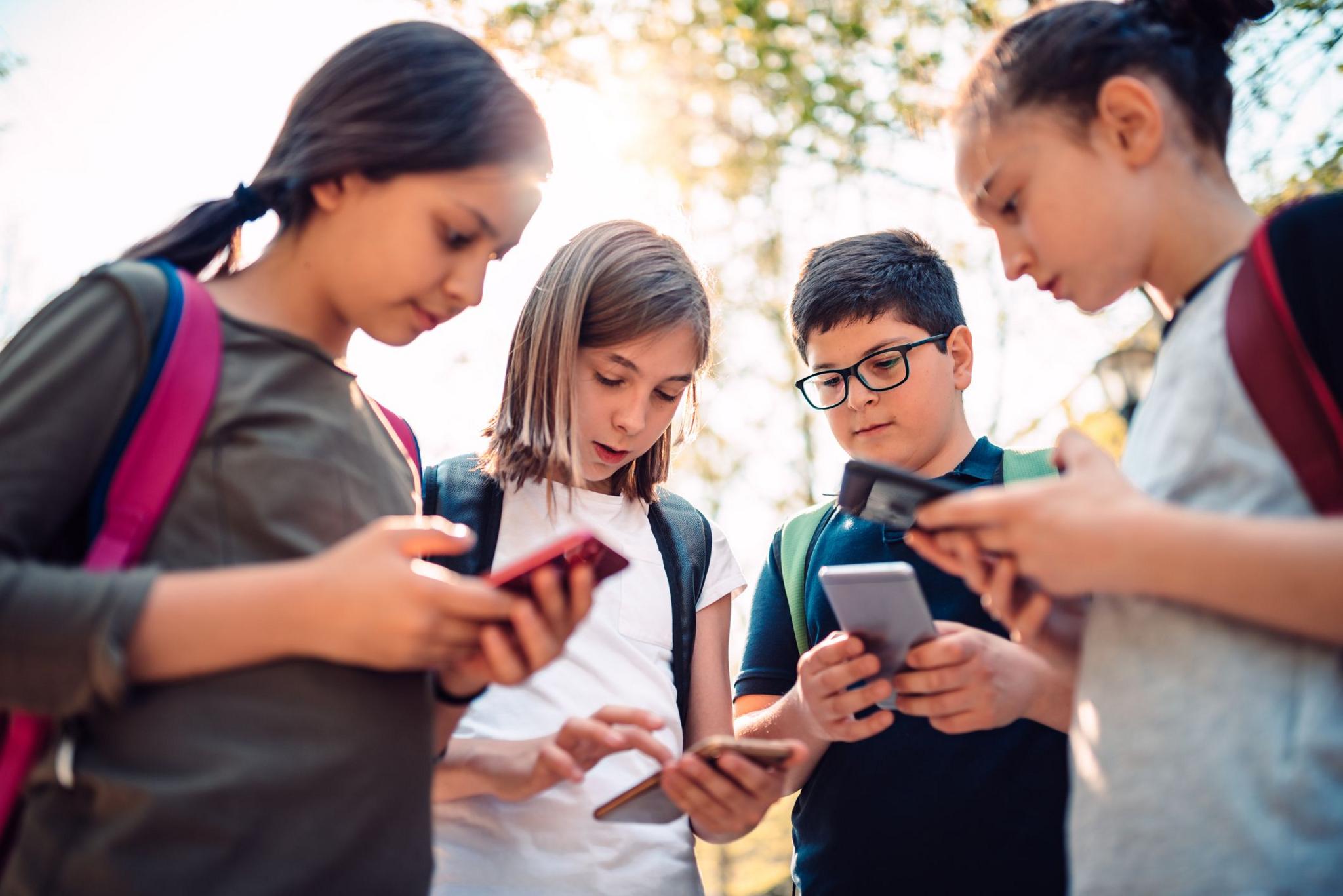 children using mobile phones. 