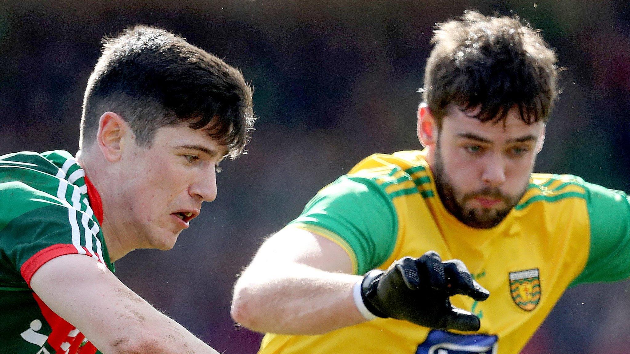 Mayo's Conor Loftus battles with Donegal's Odhran MacNiallais