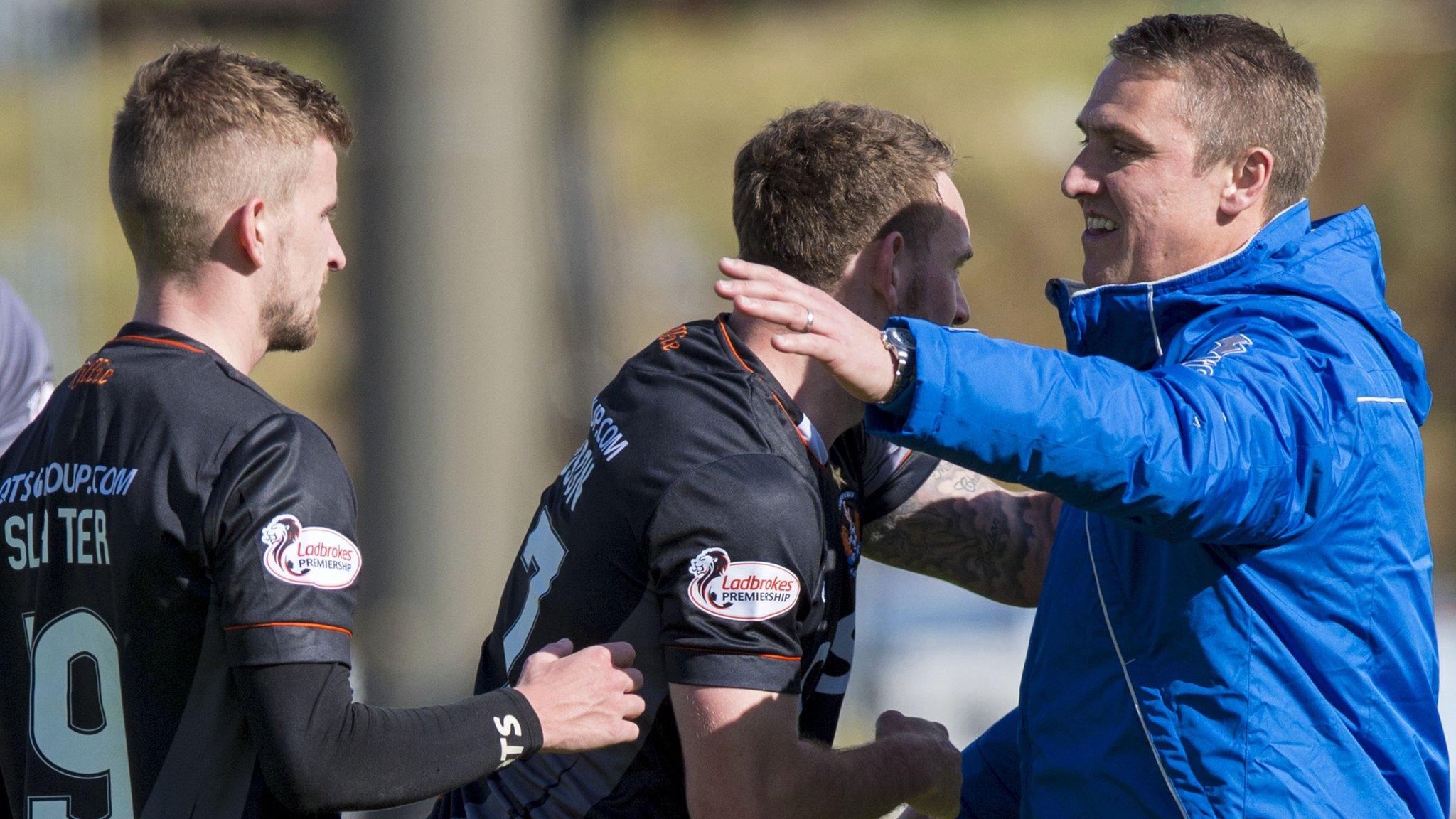 Kilmarnock manager Lee Clark congratulates his players