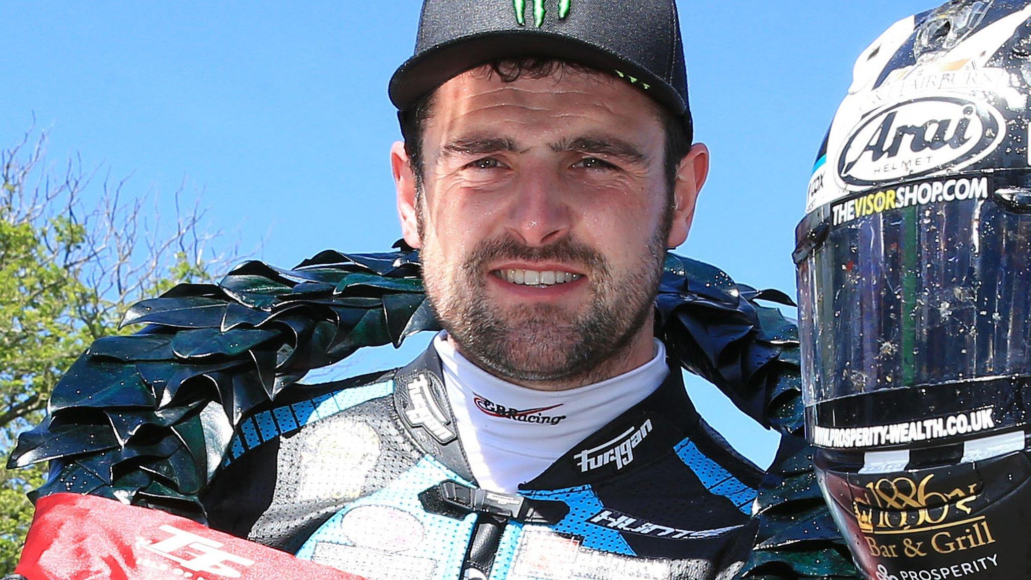 Michael Dunlop celebrates his Supertwins victory