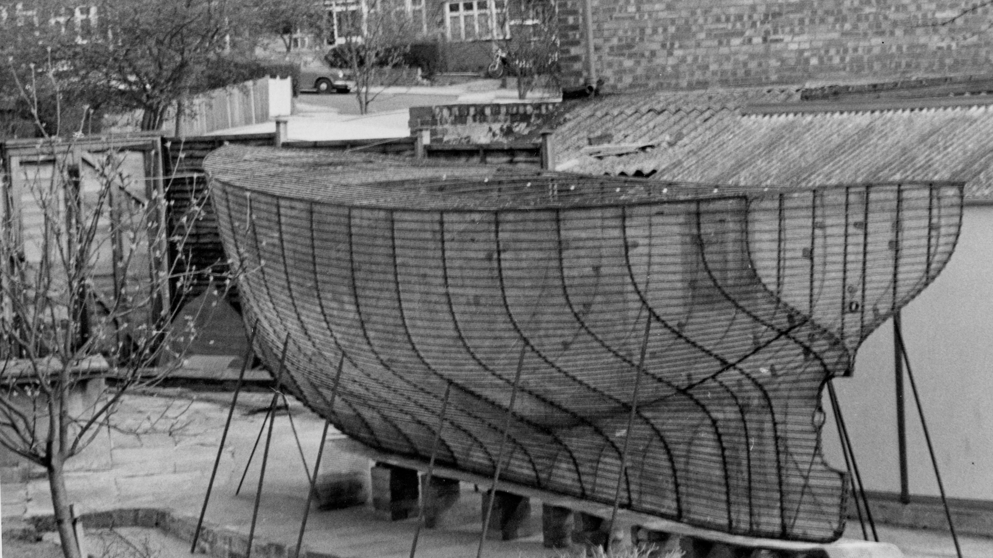 Boat frame pictured in a yard