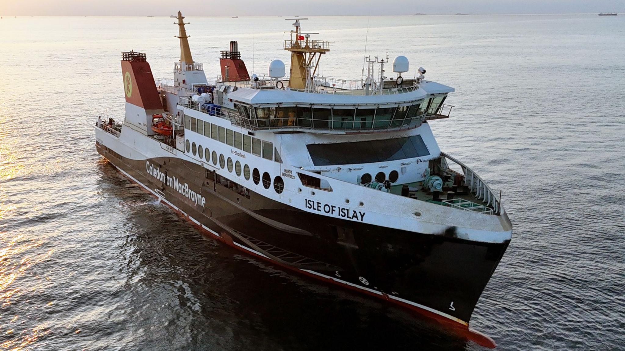 A black and white ship with red funnels and Isle of Islay written on the bow
