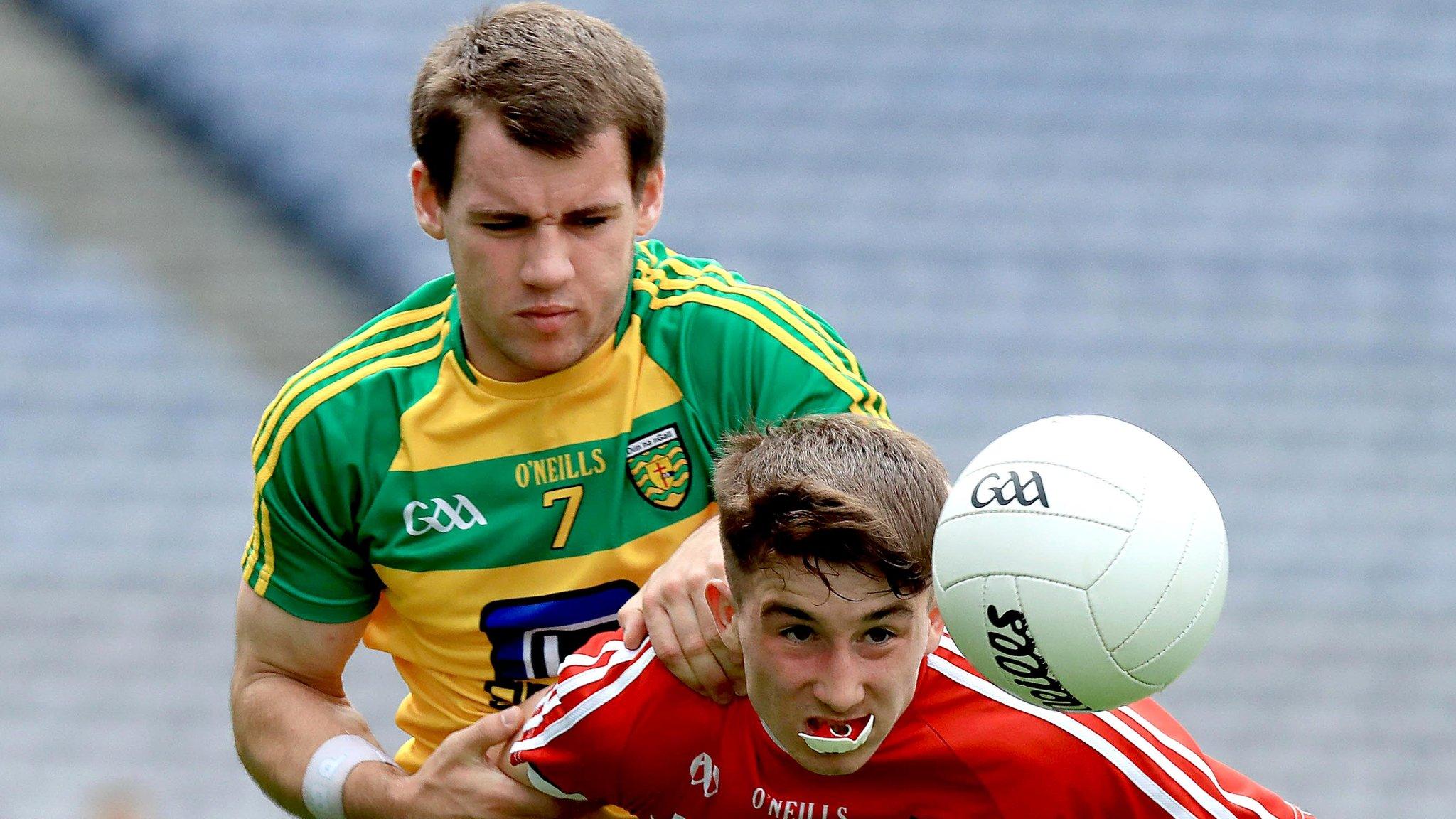 Donegal's Aidan McLaughlin battles with Cork's Chris Og Jones