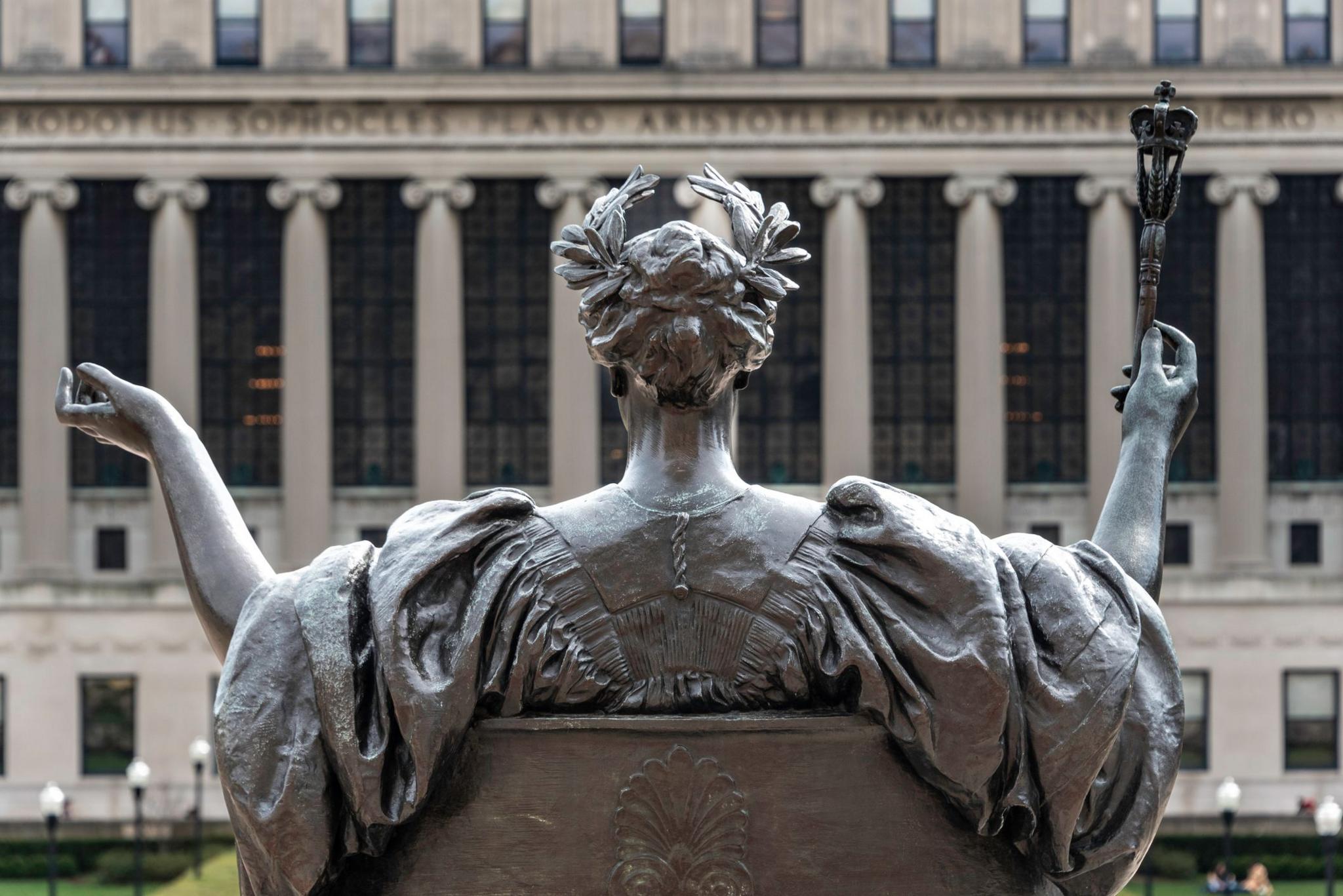 A view of the back of a statue at Columbia University