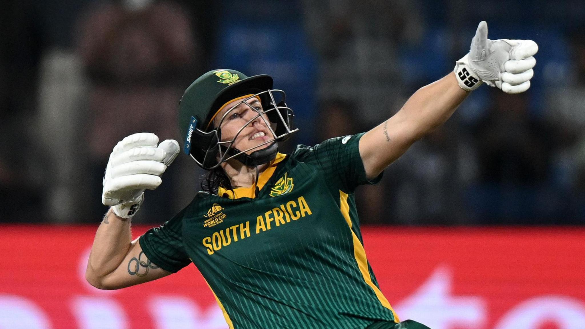 South Africa batter Tazmin Brits celebrates her century by pretending to fire a bow and arrow