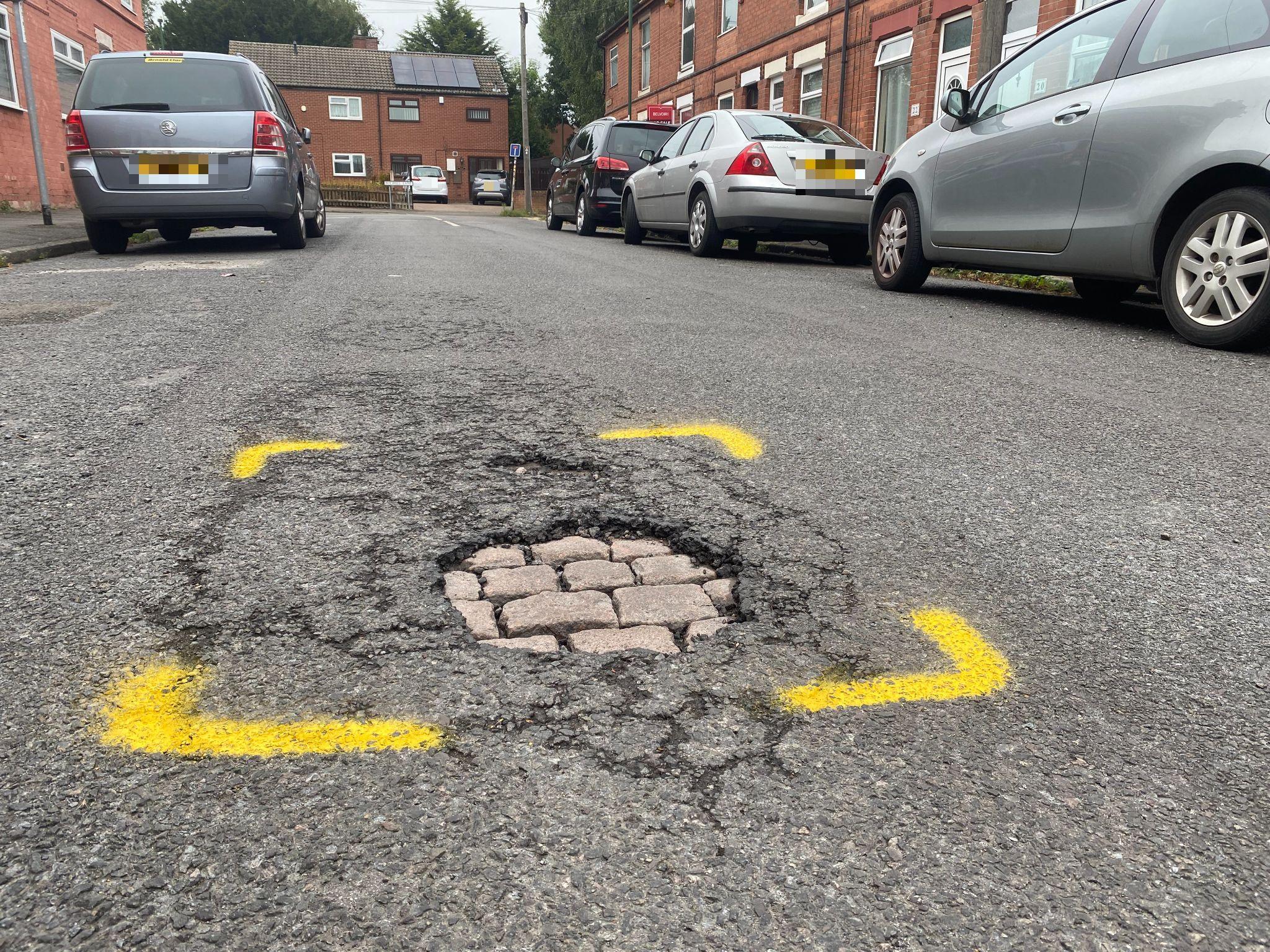 A pothole in a road in Basford, Nottingham