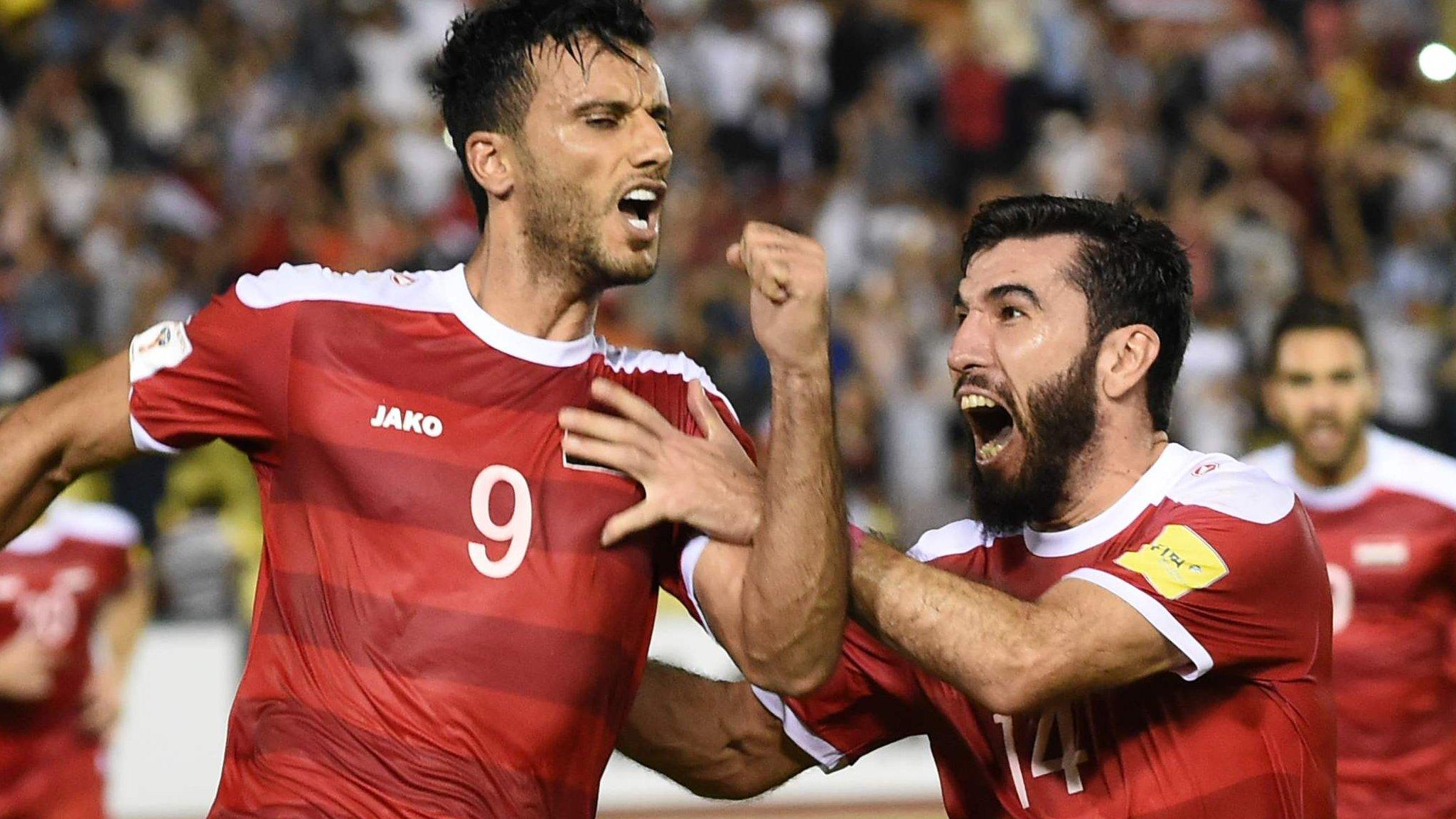 Syria players celebrate