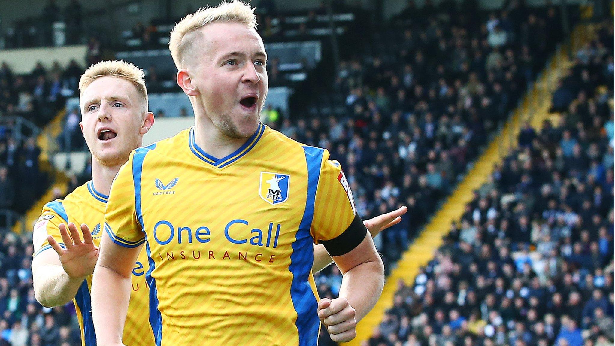 Louis Reed celebrates scoring Mansfield's equaliser against Notts County