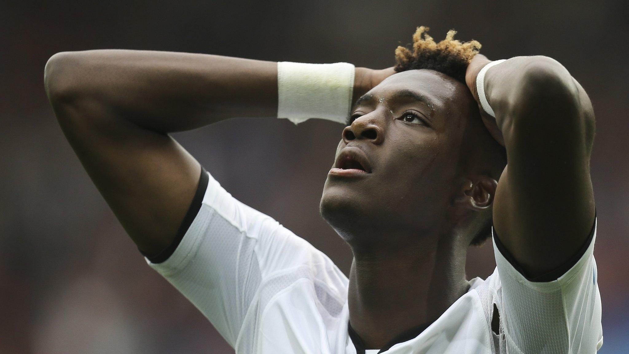 A frustrated Tammy Abraham looks skyward with his hands on his head