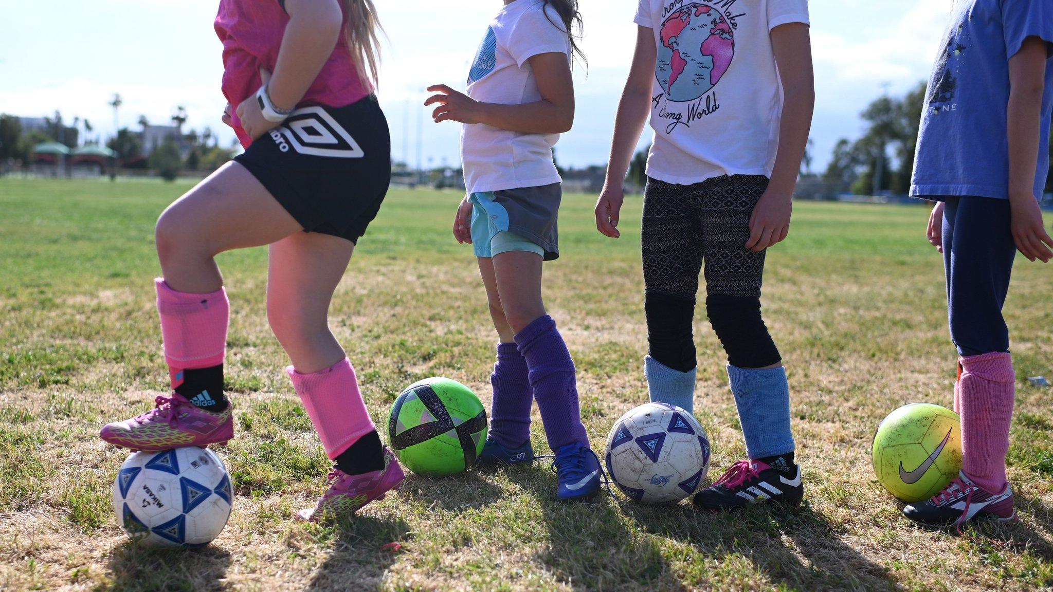 children playing football