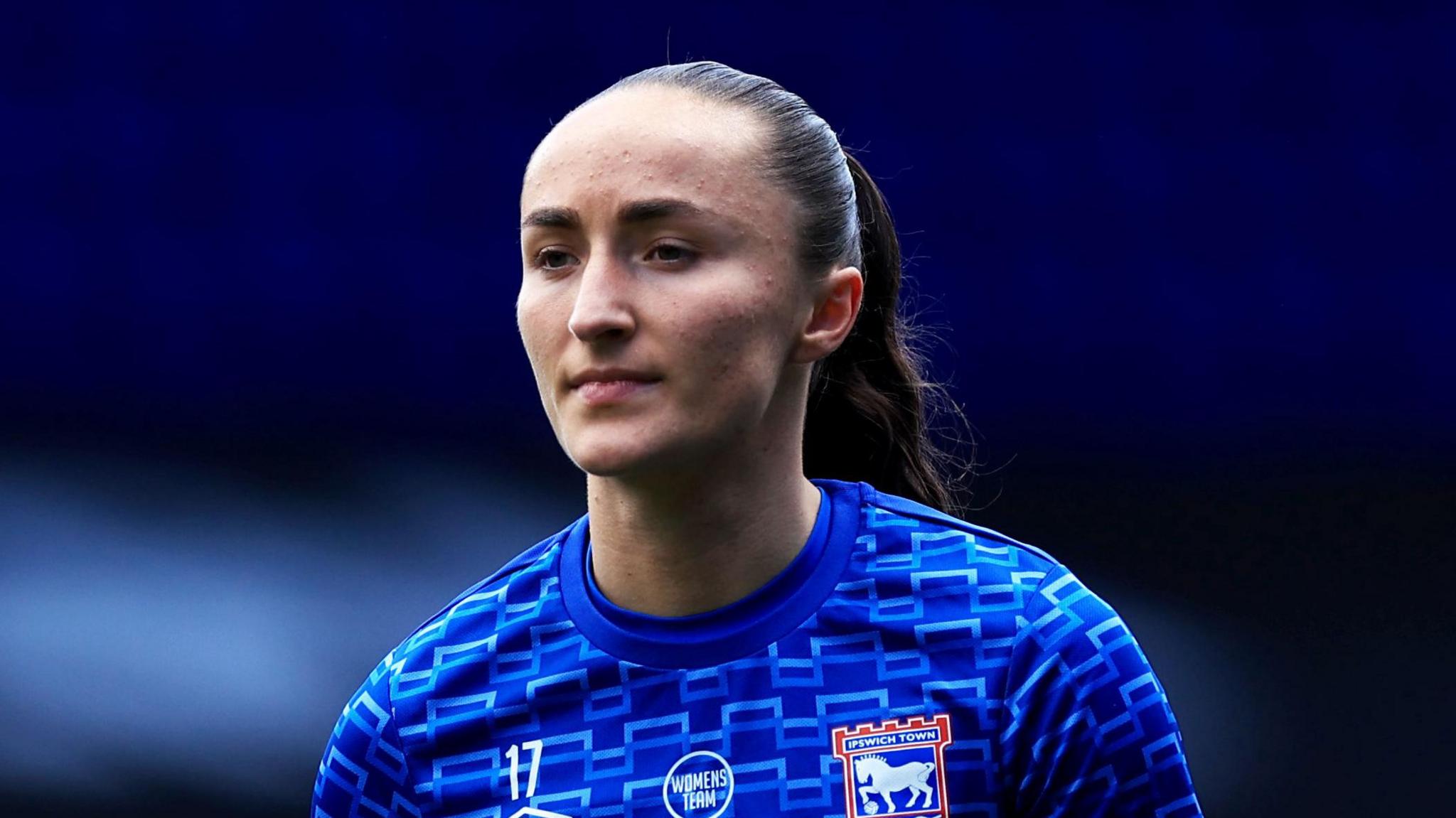 A close-up of Sophie Peskett wearing an Ipswich Town kit during a match in March