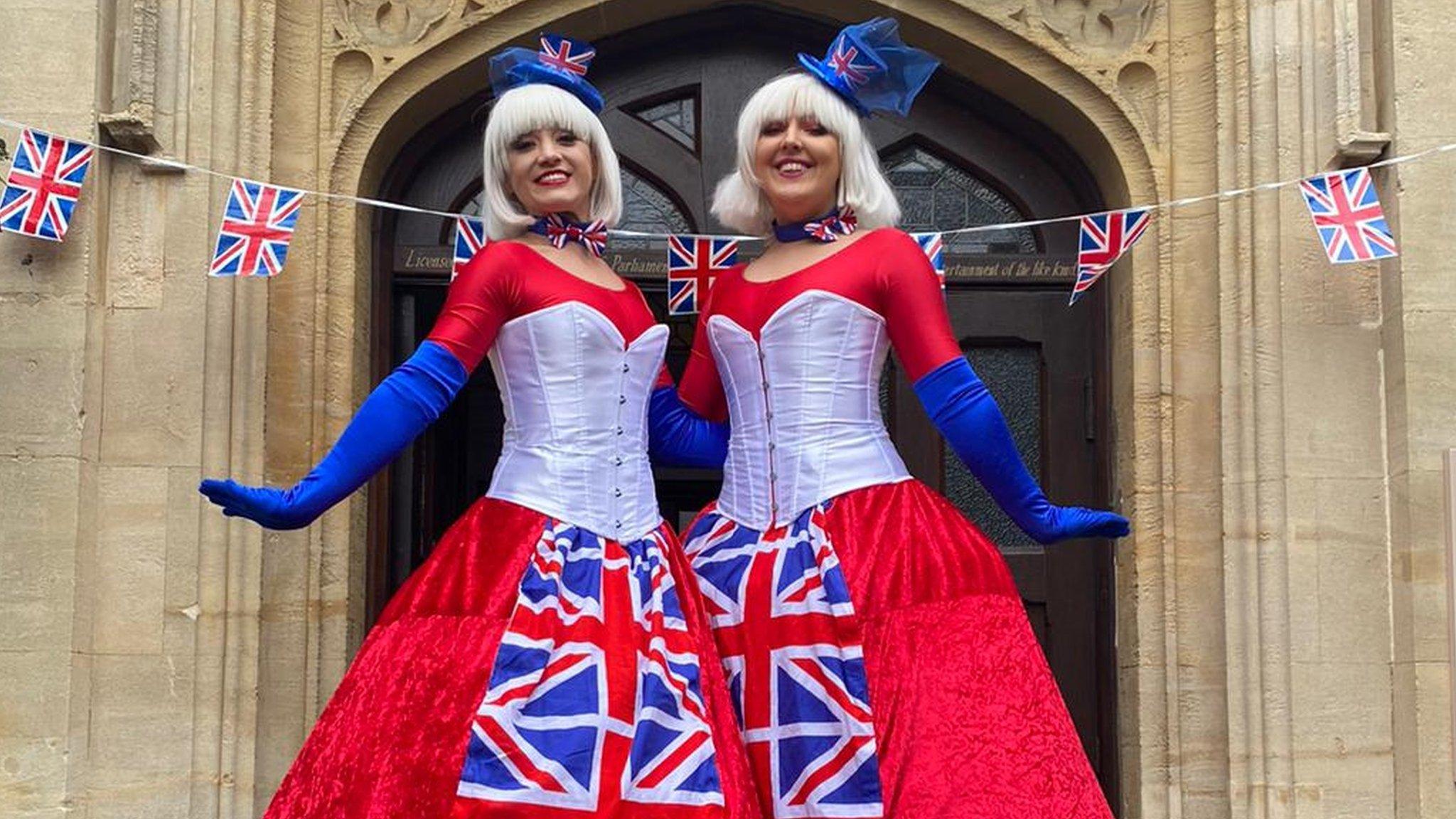 Two Jubilee stilt walkers