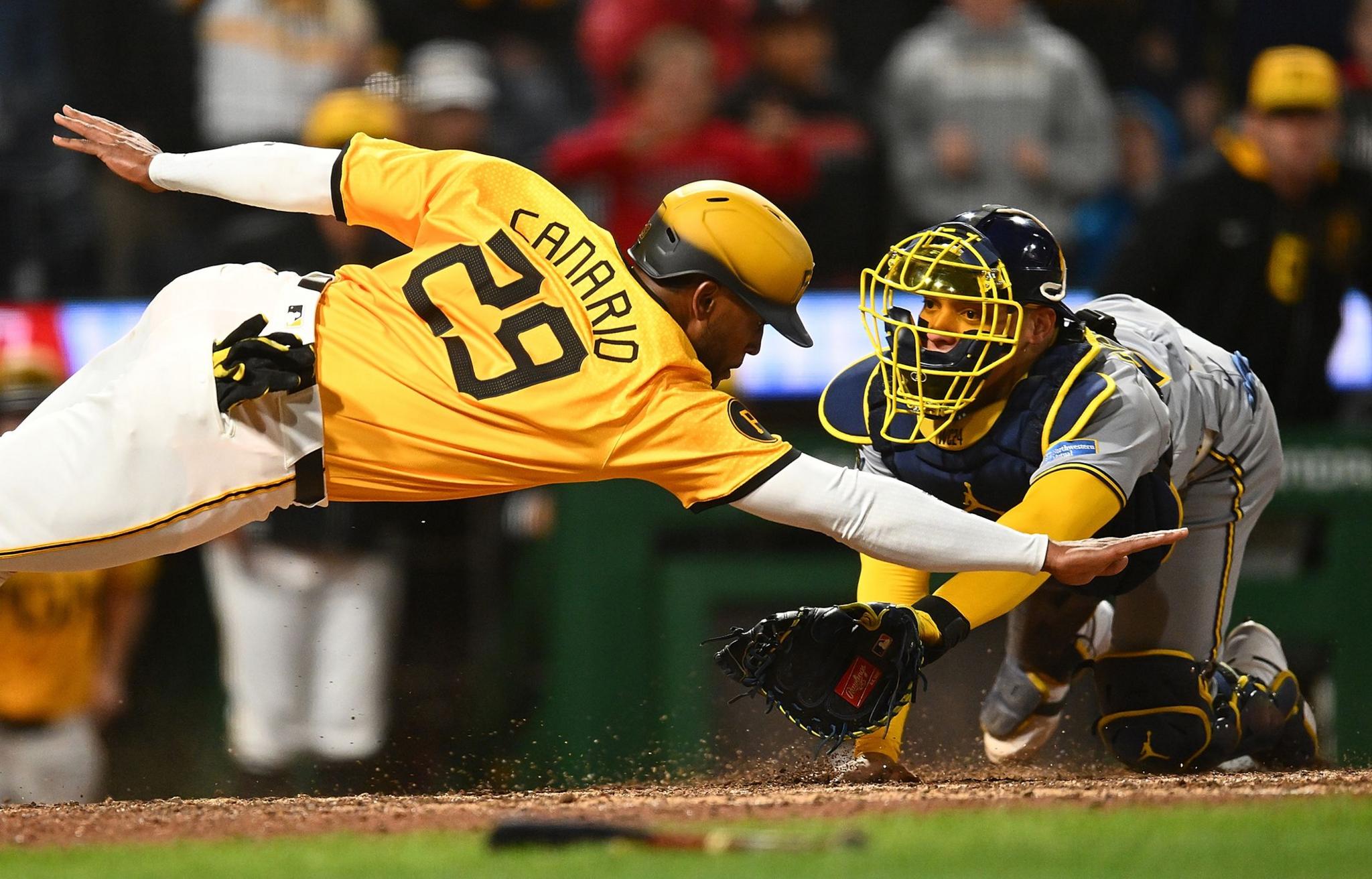 Pittsburgh Pirates' Alexander Canario is tagged out at home plate by Milwaukee Brewers' William Contreras during the tenth inning at PNC Park in Pittsburgh, Pennsylvania. Photo by Joe Sargent