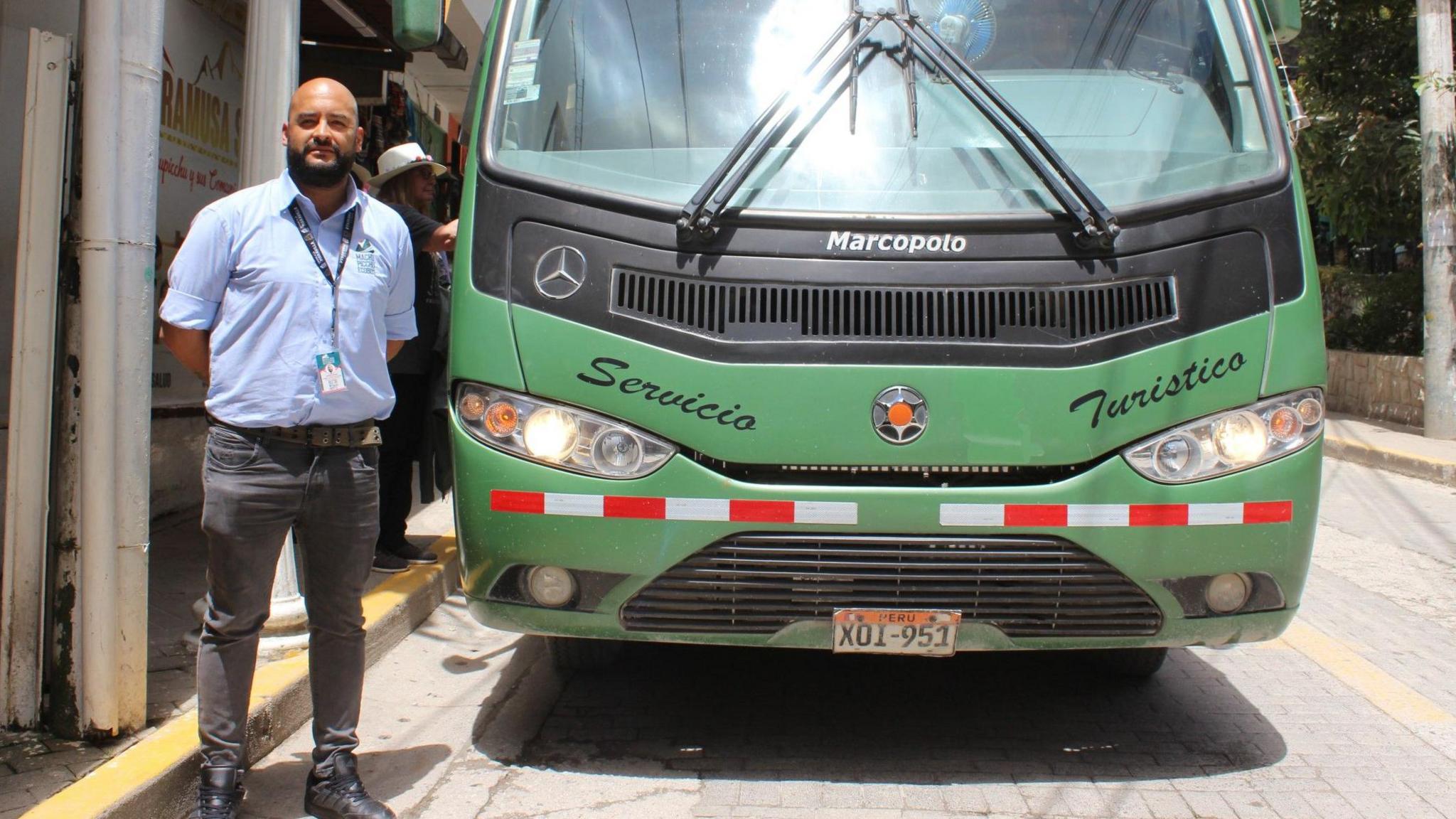 Cristian Alberto Caballero Chacón, head of operations for bus company Consettur, standing in front of one of its vehicles