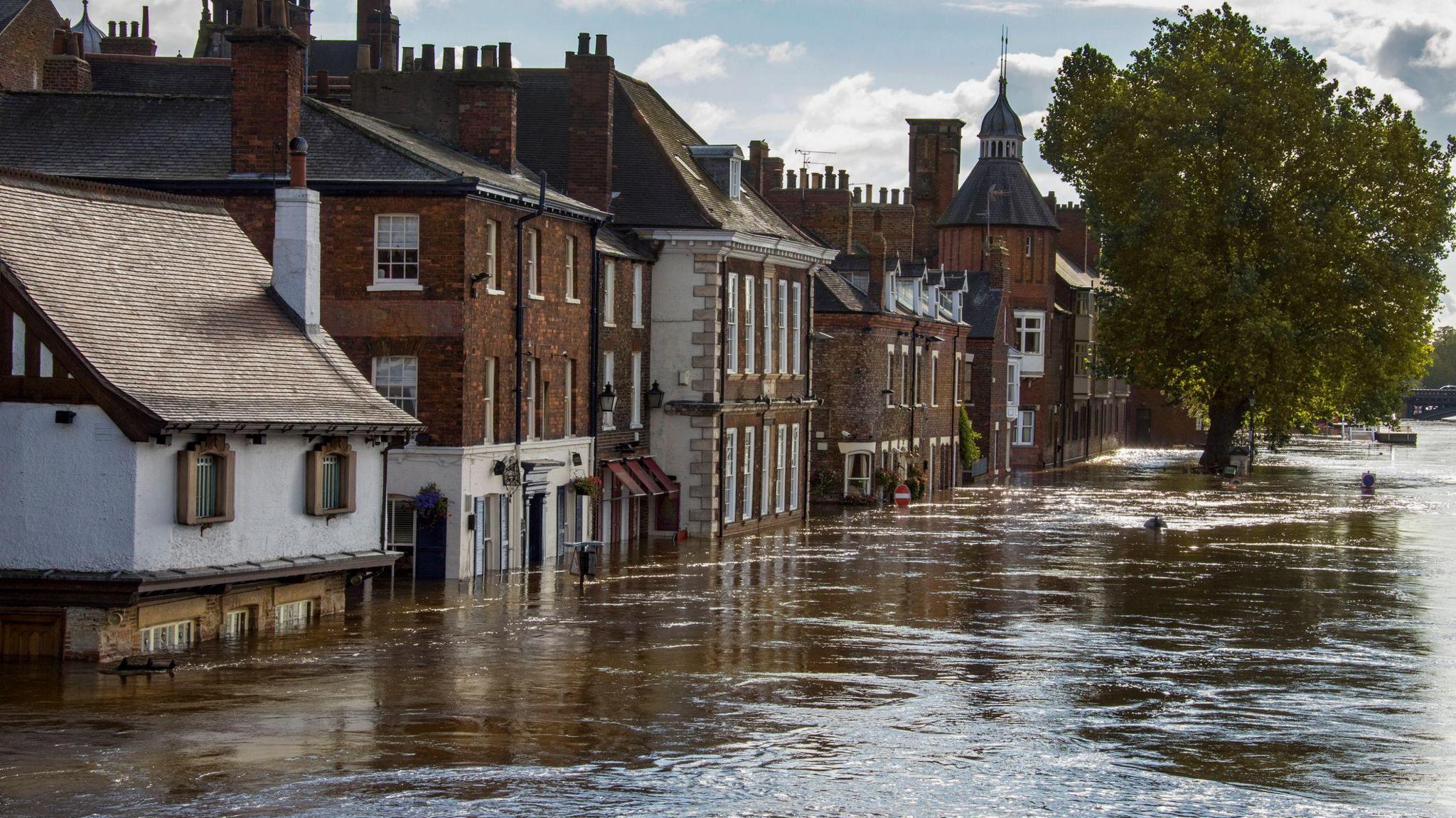 Flooded street with the water line high on properties in York