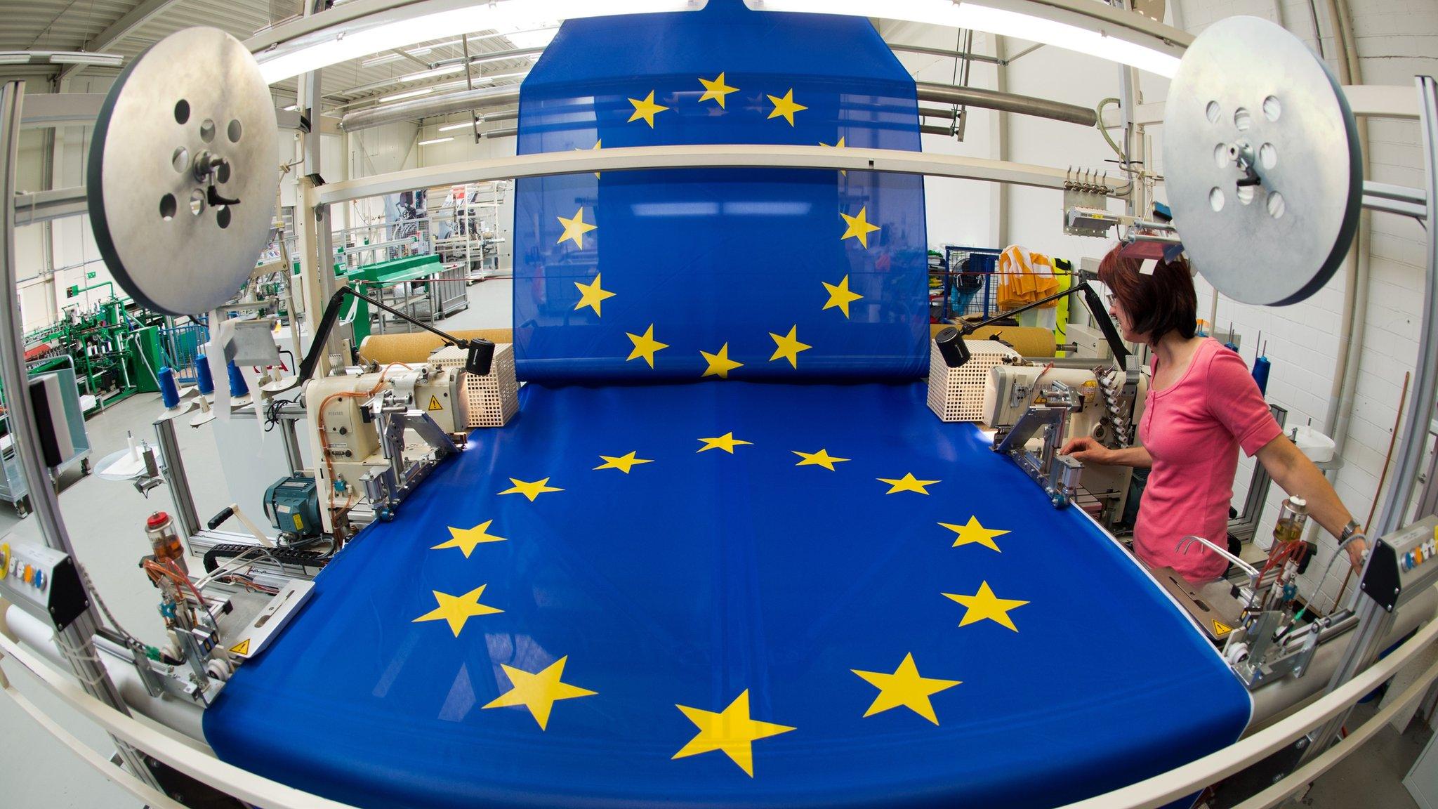 Worker at a flag-making factory in Germany