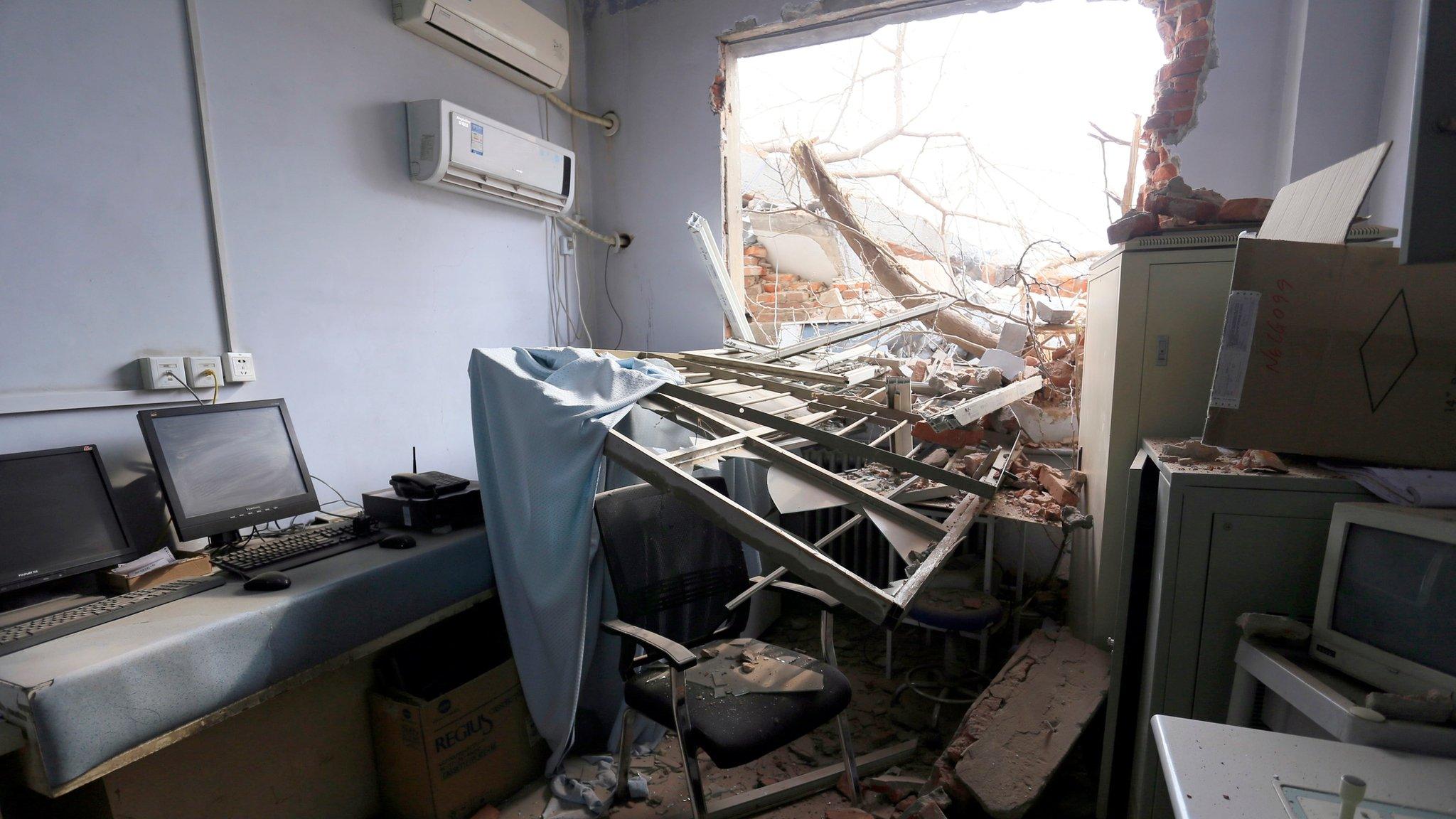 In this Thursday, Jan. 7, 2016 photo, rubble and debris spills into a room at the No. 4 Hospital of Zhengzhou University after a demolition crew destroyed part of the facility in Zhengzhou in central China"s Henan province