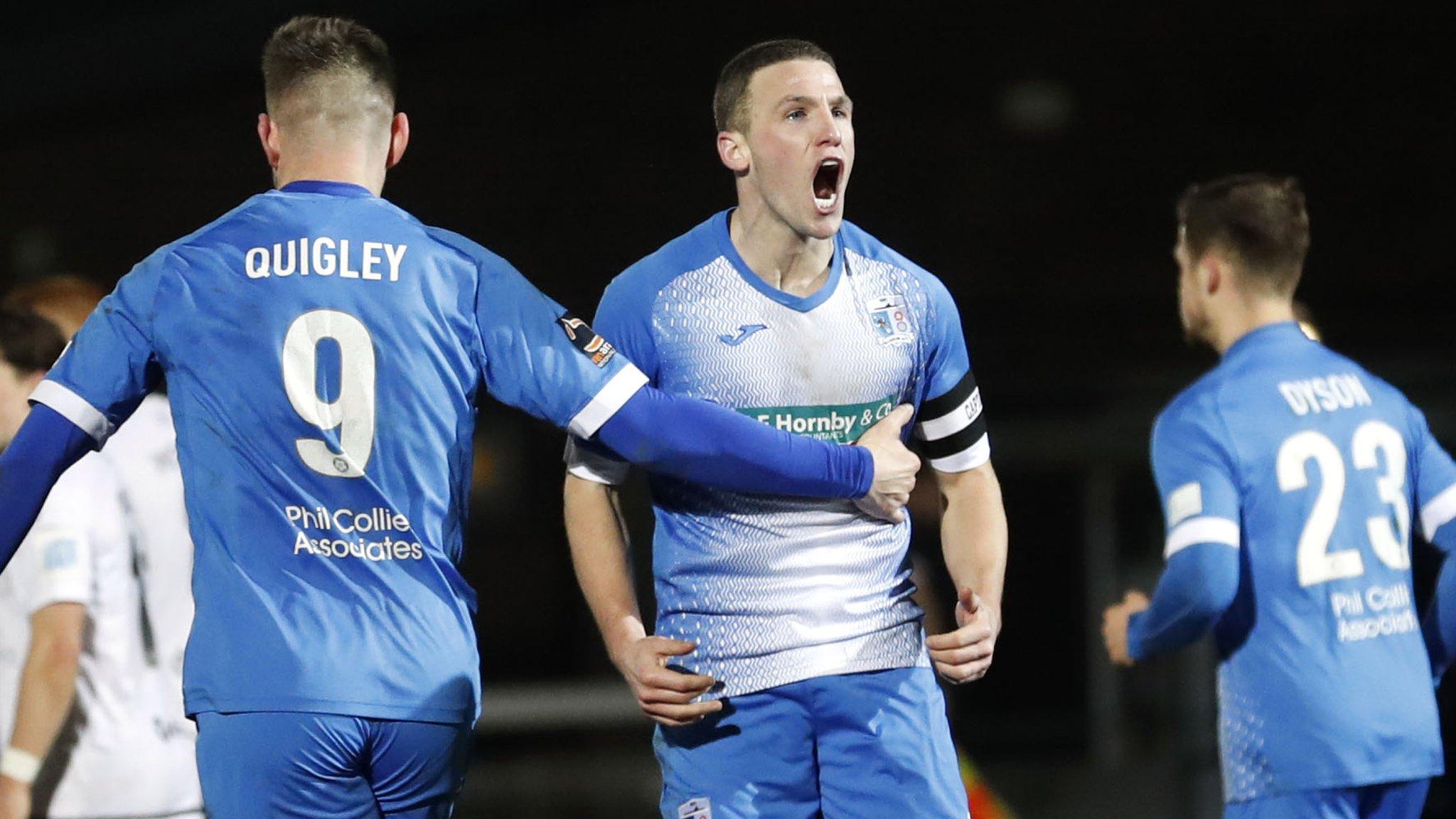 John Rooney scores a goal for Barrow