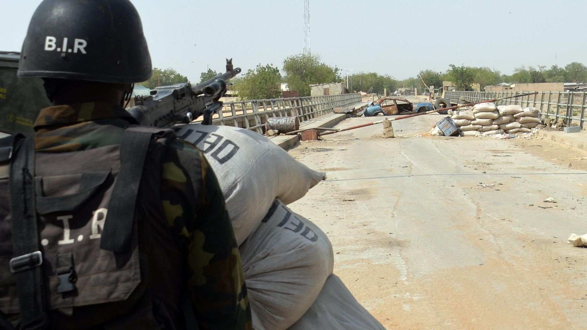 A Cameroonian soldier standing post in the Cameroonian town of Fotokol, on the border with Nigeria, after clashes involving Nigeria-based Boko Haram insurgents - 2015