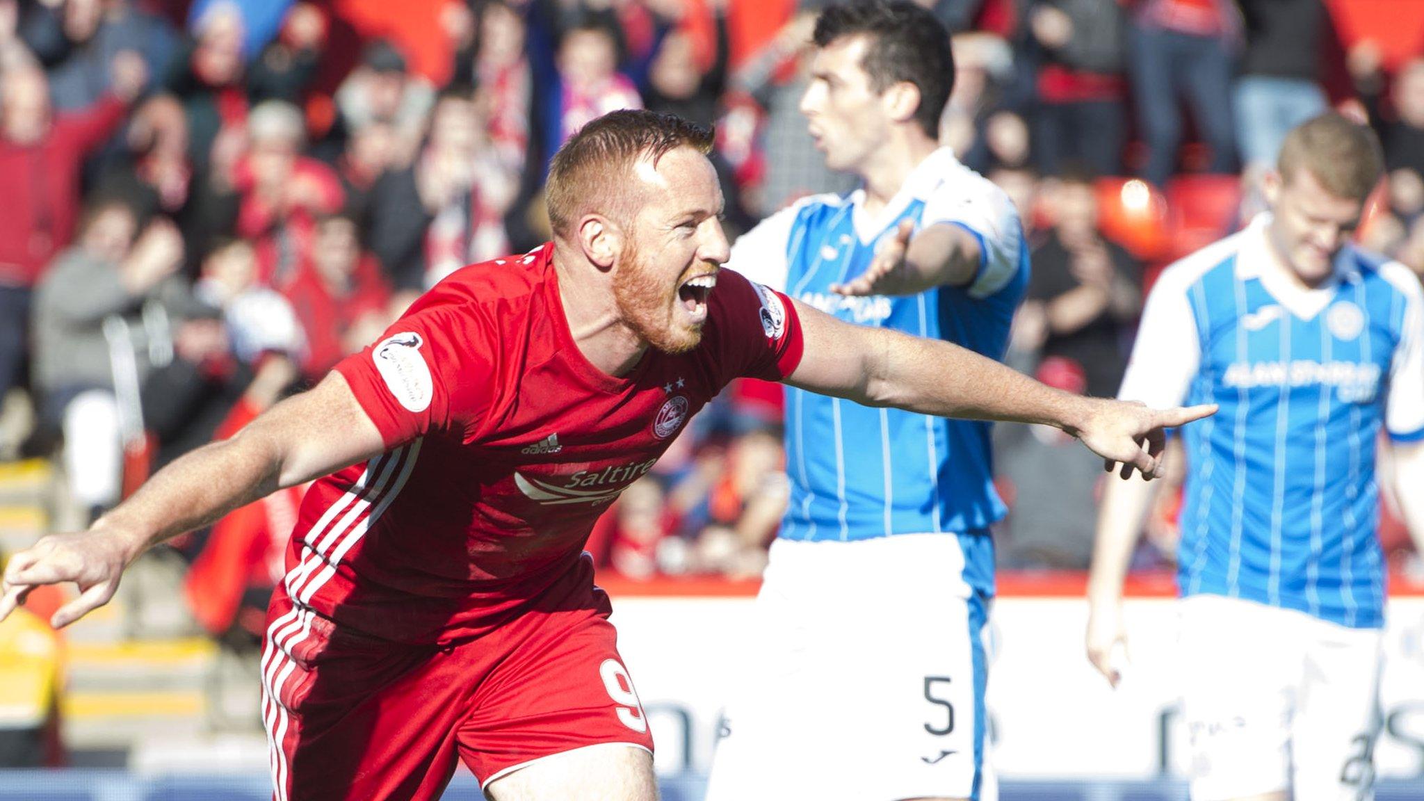 Adam Rooney celebrates the opening goal at Pittodrie