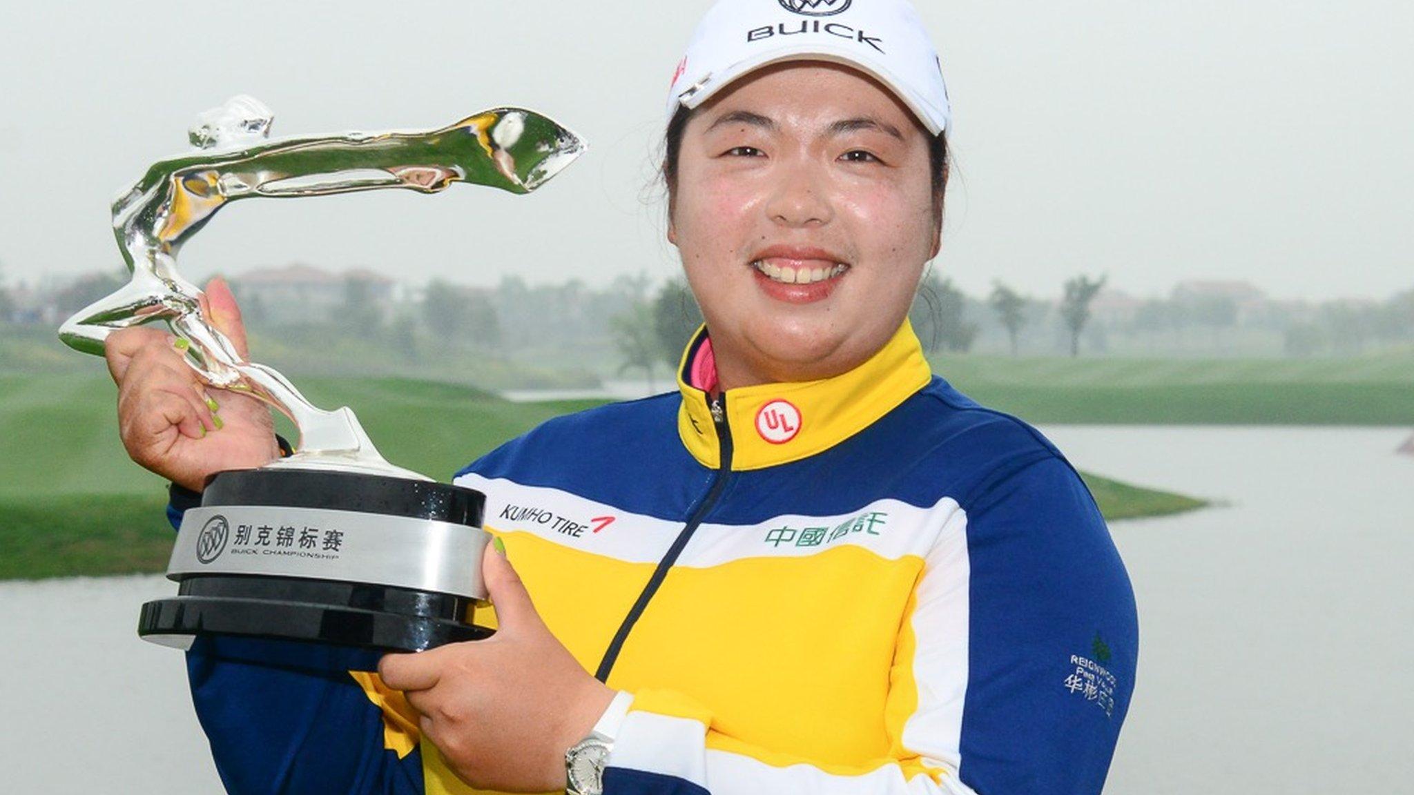 Shanshan Feng with the Buick Championship trophy