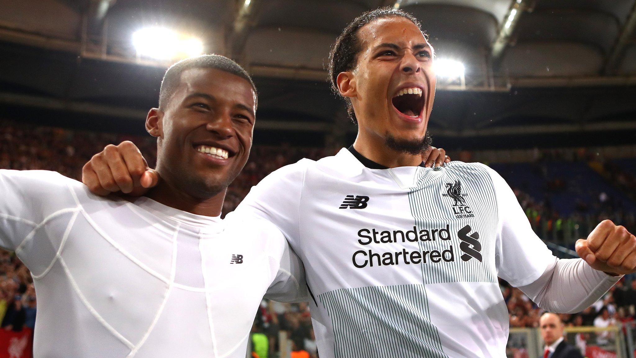 Liverpool players celebrate reaching the Champions League final after beating Roma on aggregate