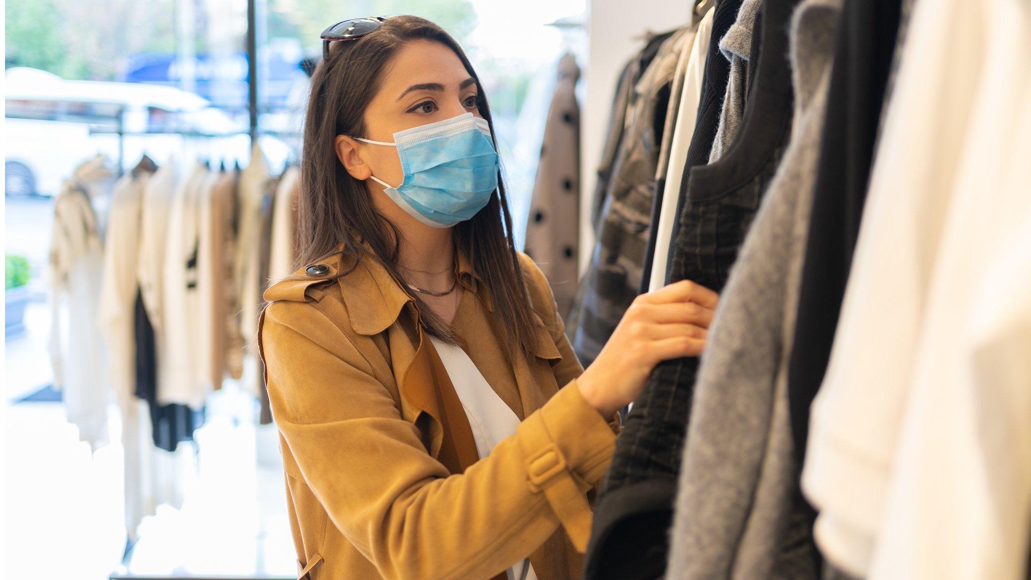 Woman shopping while wearing face mask