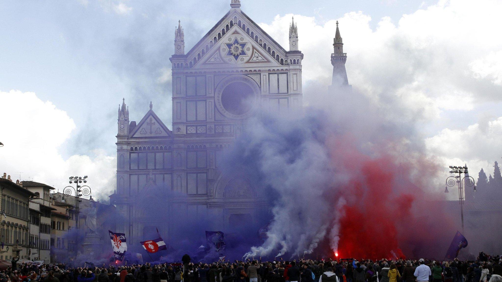 Crowds gather outside Santa Croce church in Florence