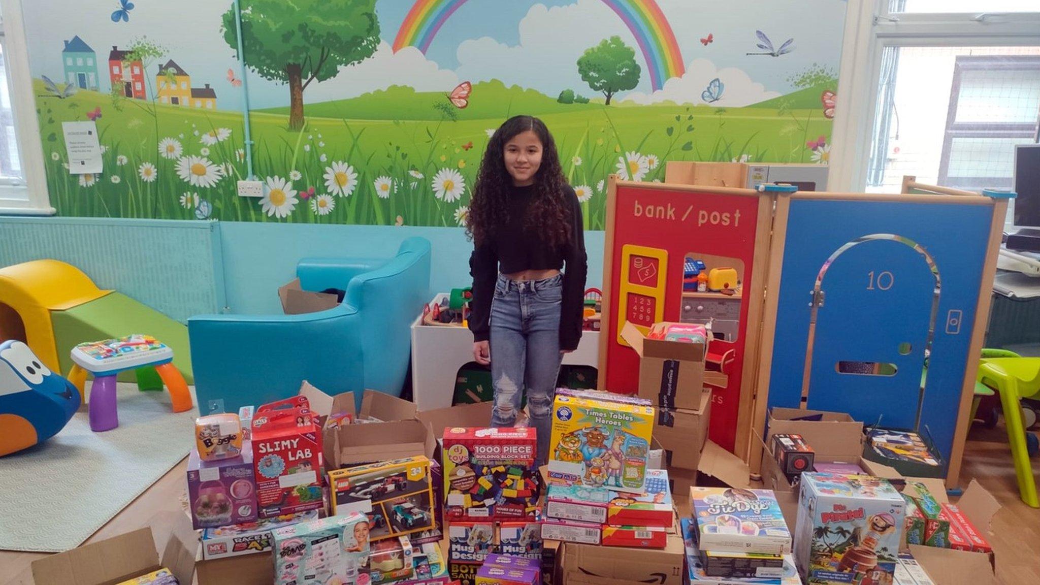 Rhea Oke with the toys that were donated