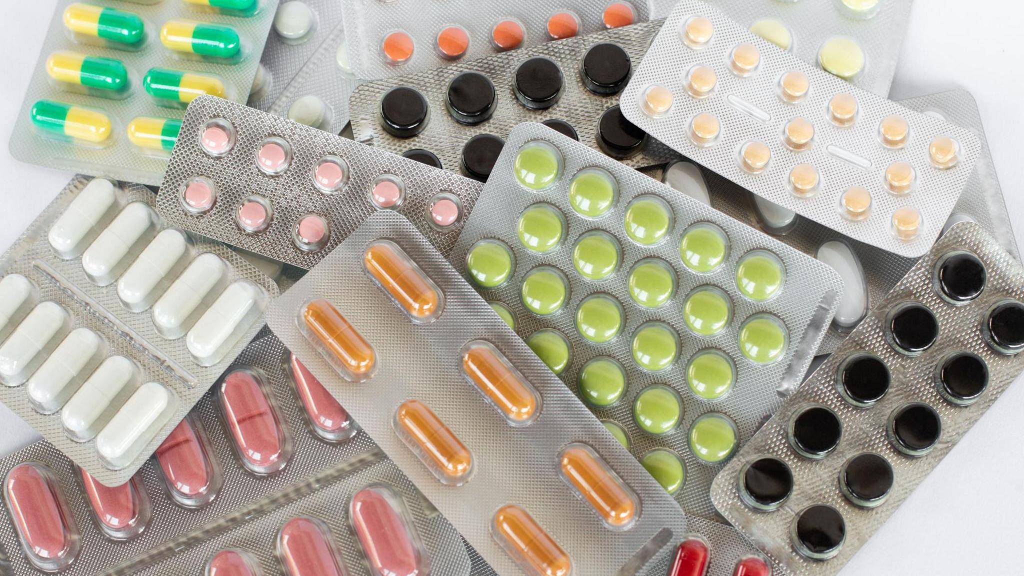 An array of tablets of varying colours