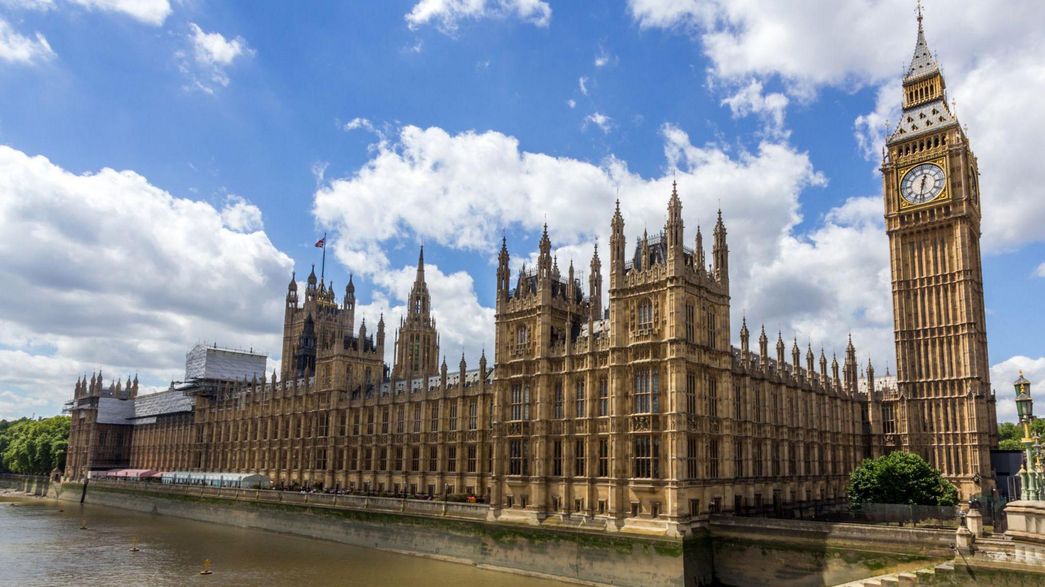 A shot of the House of Commons from across the Thames river in London.