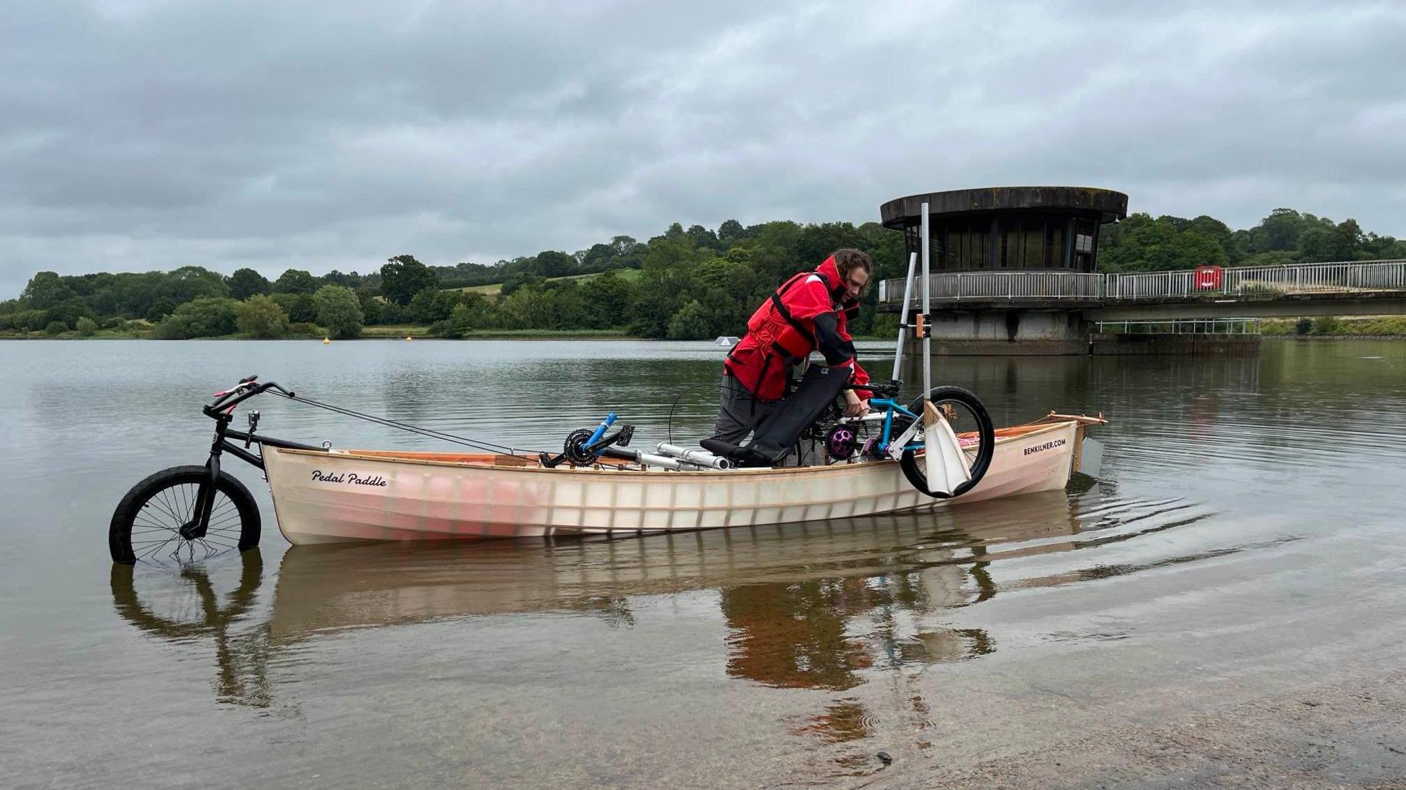 Ben Kilner in self-built amphibious bicycle canoe