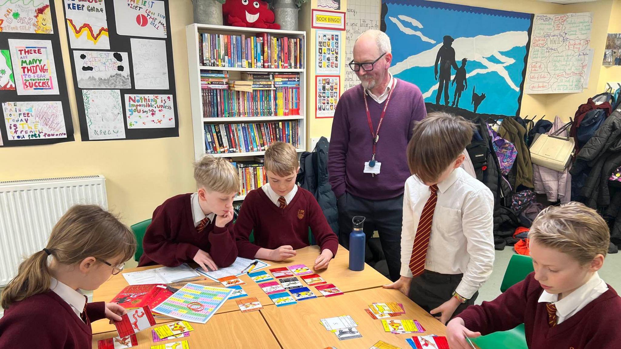 The Year 6 pupils playing their Doggy Cards