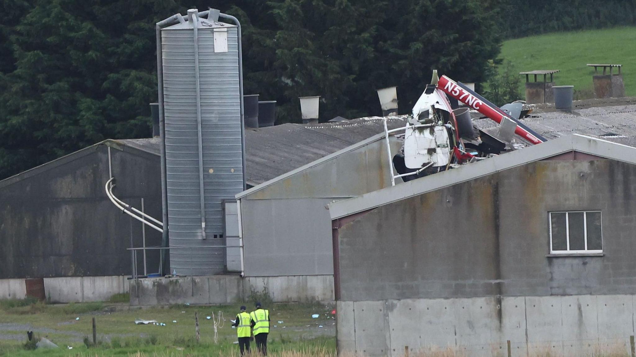 Helicopter crash into the roof of a barn building