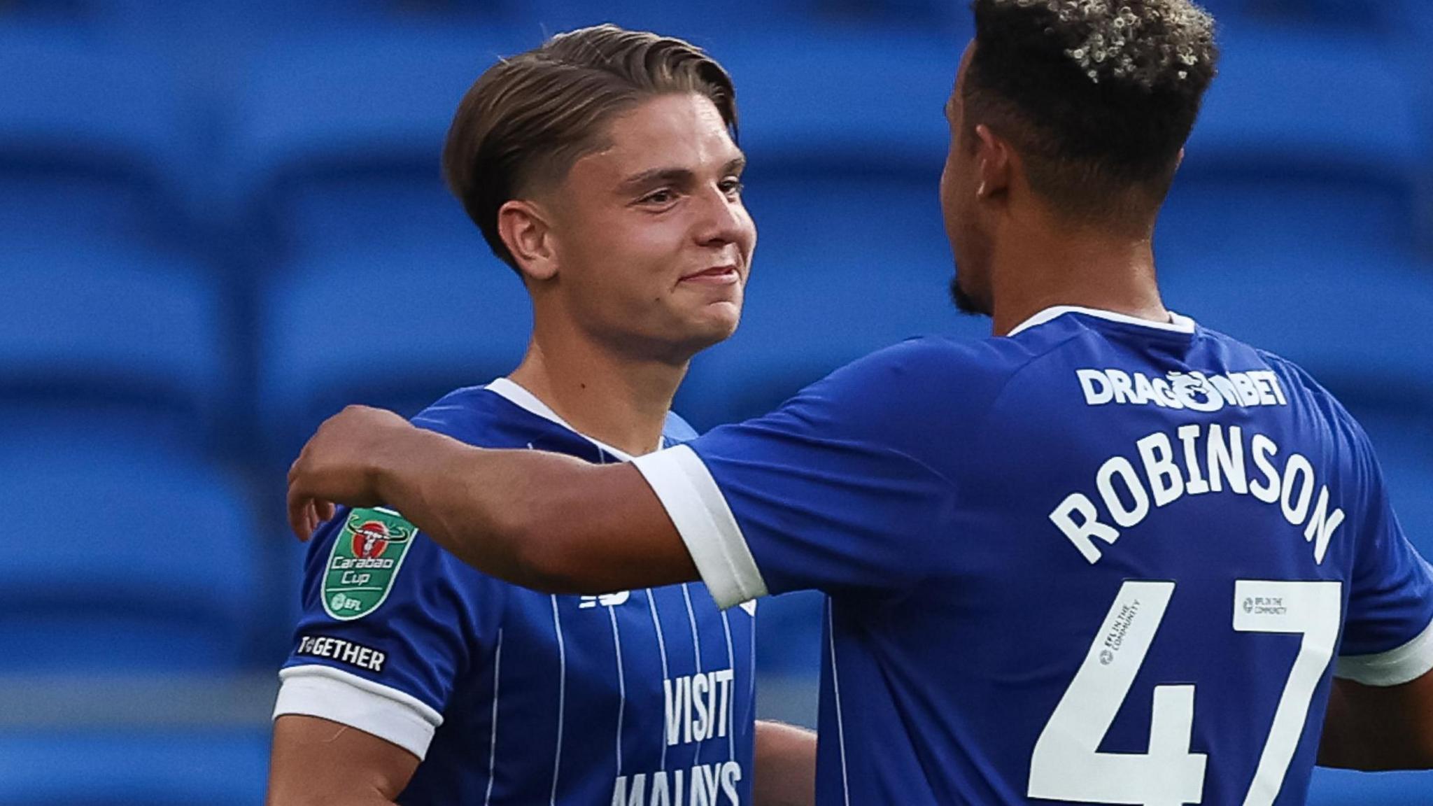 Cian Ashford (left) celebrates scoring a goal with Callum Robinson