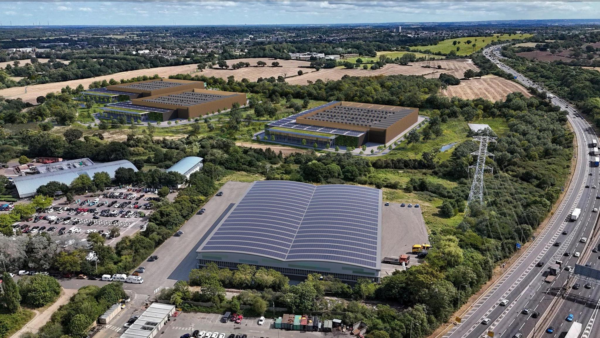 An artist's impression depicting an aerial view of what the proposed site could look like. It's a large grey warehouse-like building near the motorway