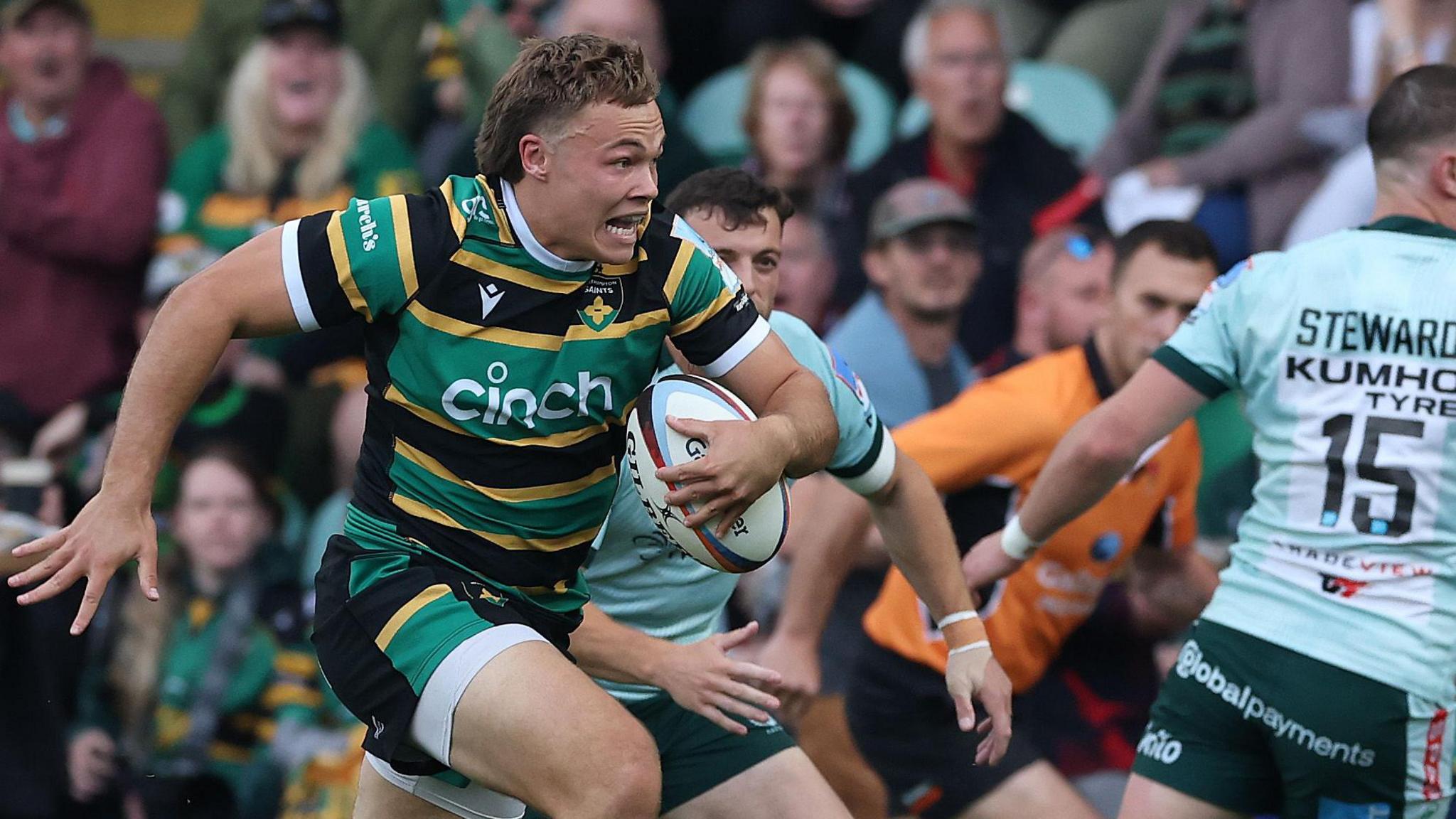 Tom Litchfield breaks through Leicester's defence to score Northampton's first try