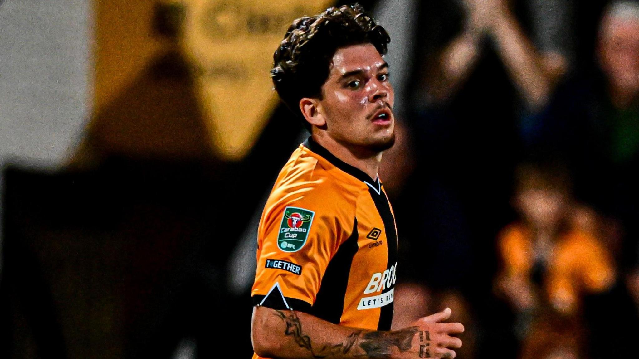 Glenn McConnell running looking right in home kit