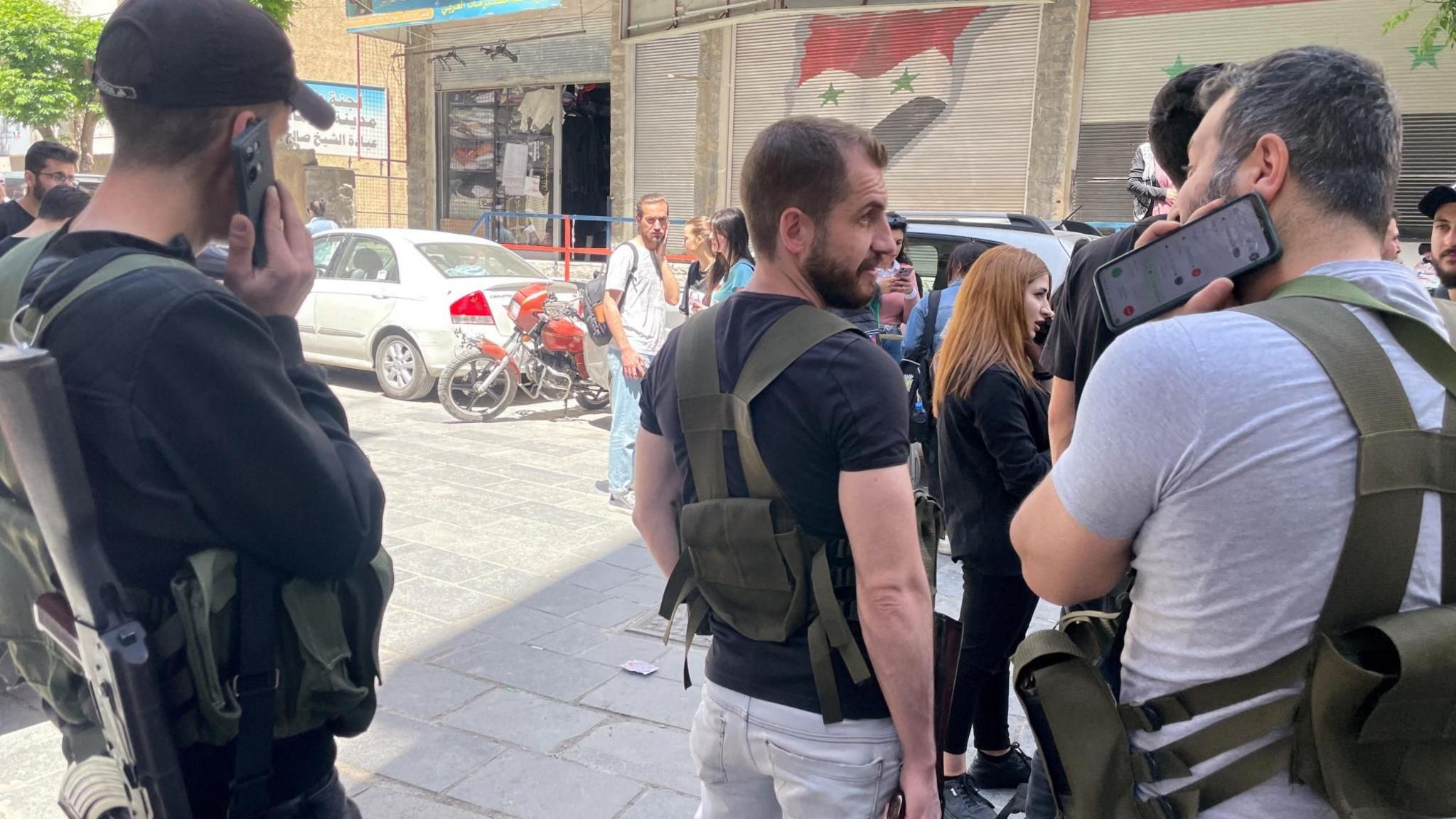 Armed Druze men stand at a checkpoint in Jaramana, a south-eastern suburb of Damascus, Syria (29 April 2025)