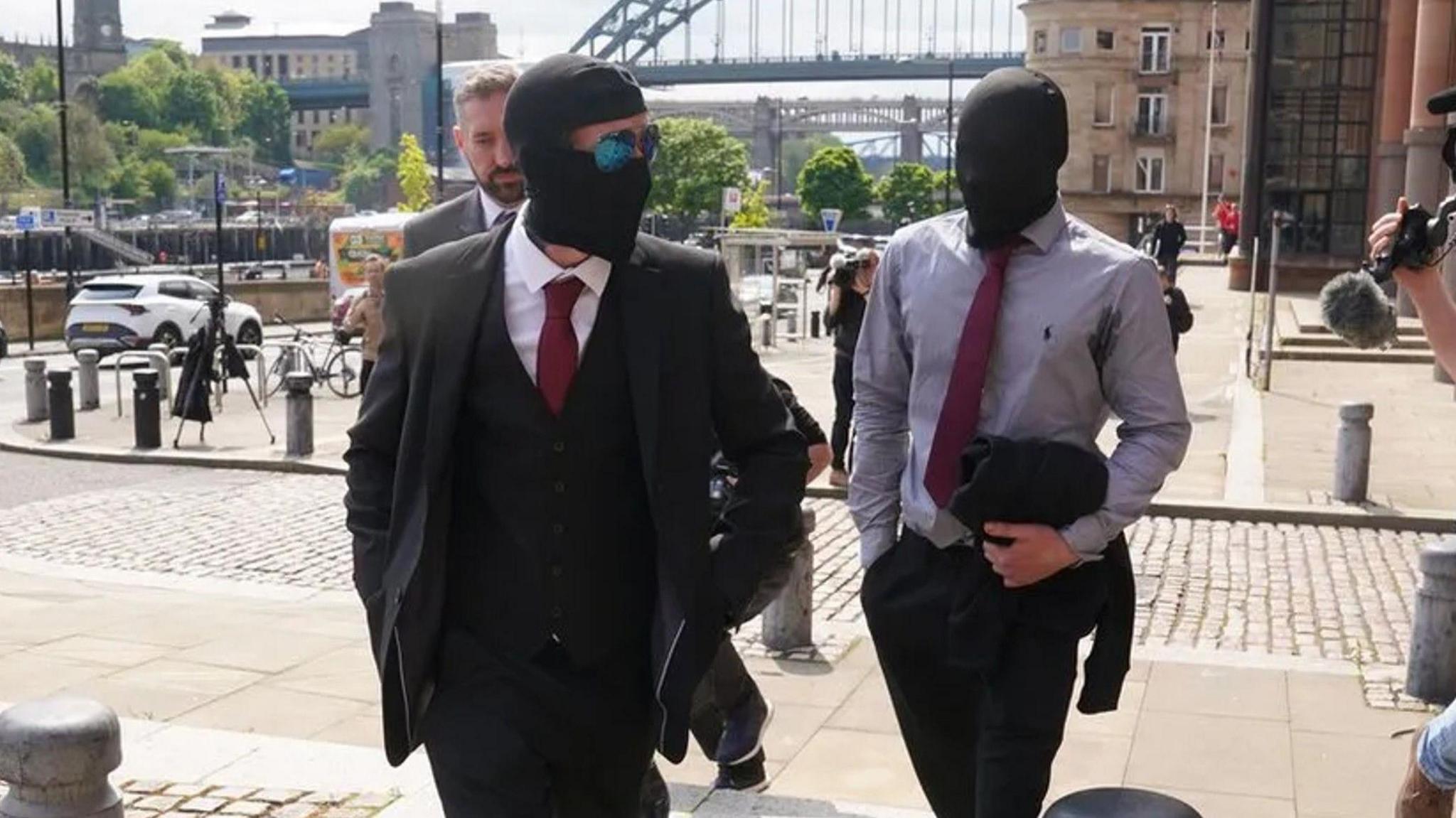 Daniel Graham (left) and Adam Carruthers leaving Newcastle Upon Tyne Magistrates' Court after appearing in connection with the felling of the Sycamore Gap tree