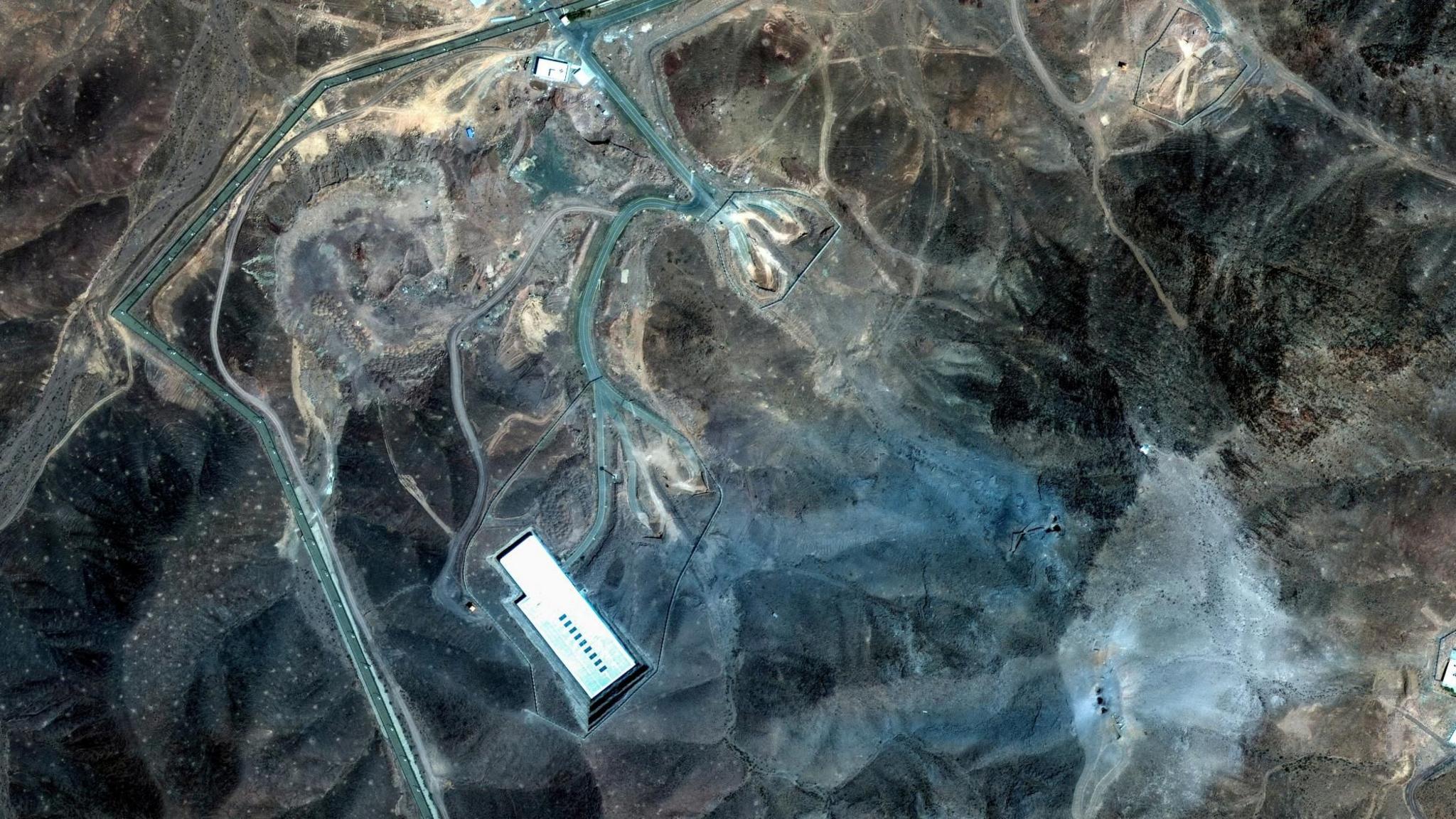 A satellite image shows damage at the Fordo underground enrichment plant following US strikes, near Qom, Iran (22 June 2025)