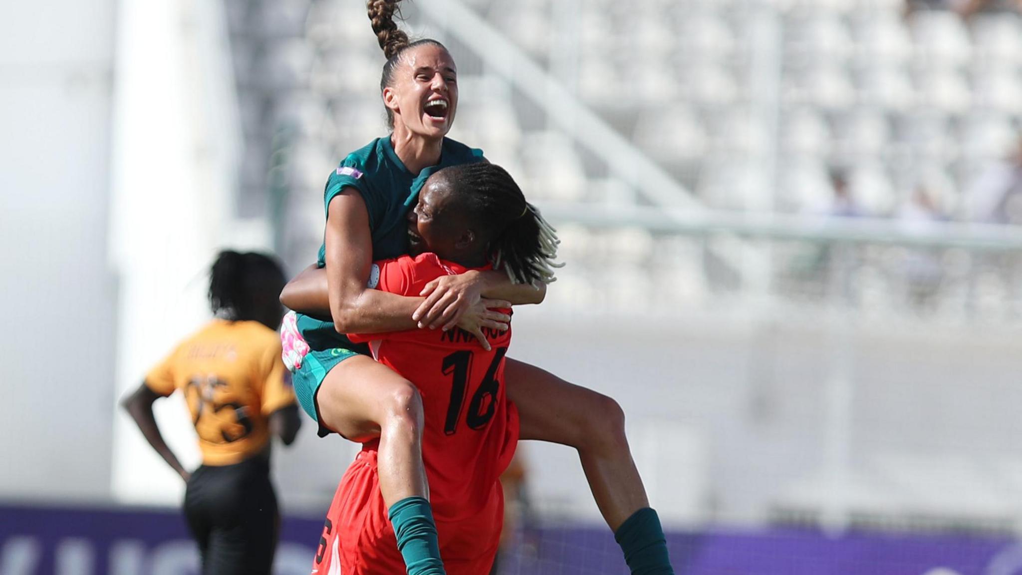 Ashleigh Plumptre and Chiamaka Nnadozie observe a Nigeria goal