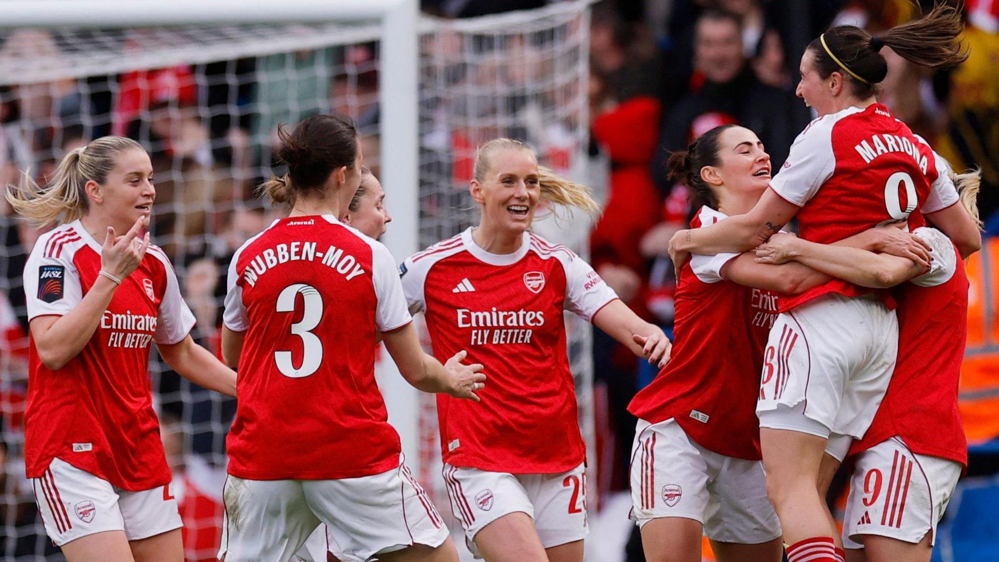 Arsenal players celebrate Mariona Caldentey's goal at Chelsea in the WSL