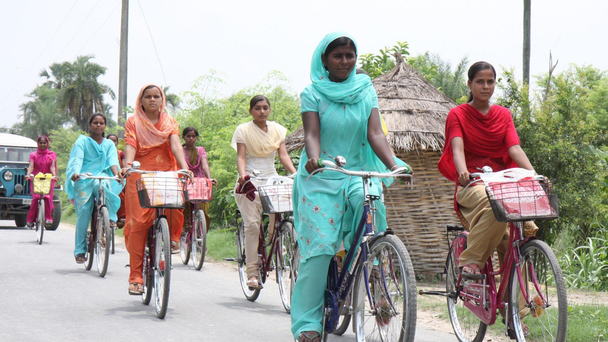 Girls pedal their way back to Khanpakri, 7 kms fom the High School Desari in Vaishali district in Bihar after attending classes on the bicycles provided under the cycle scheme of the state government.